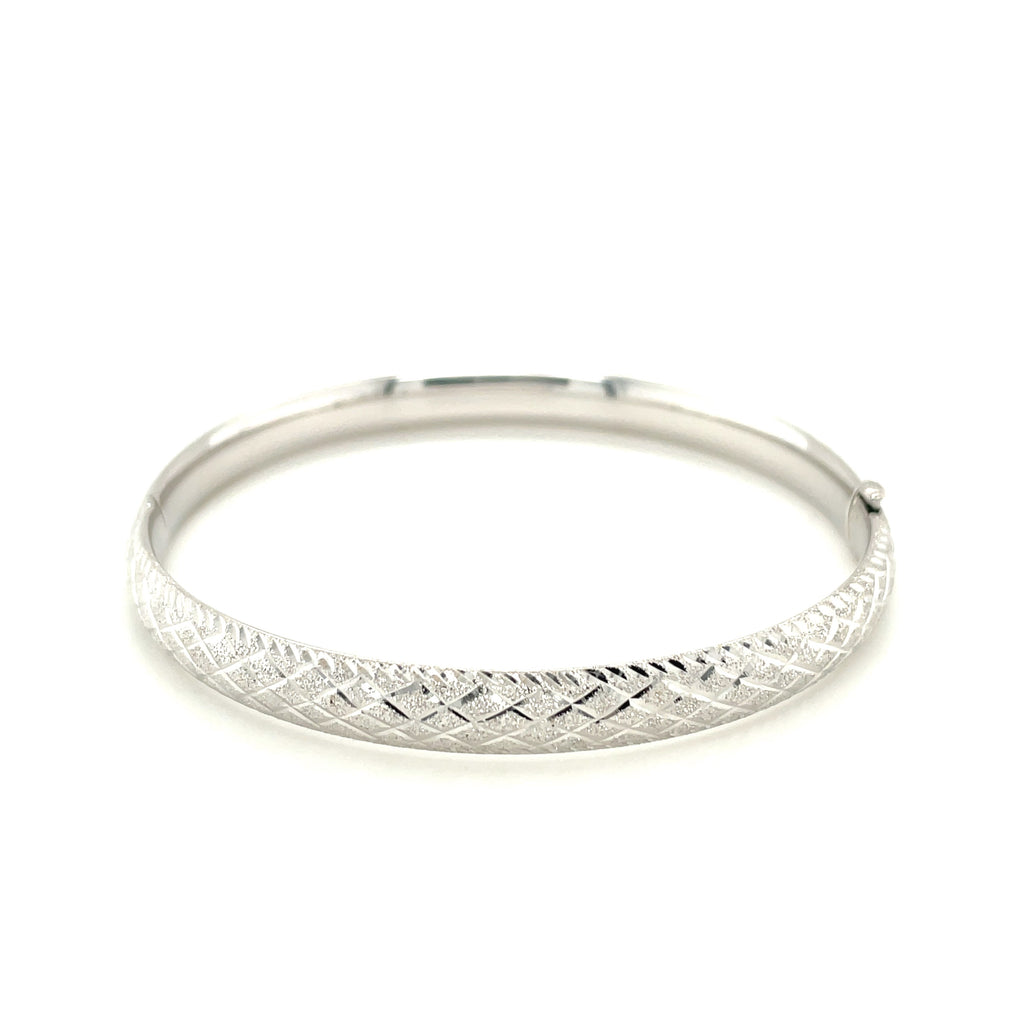 Elegant 14k white gold diamond carved bangle showcasing intricate design and luxurious craftsmanship.