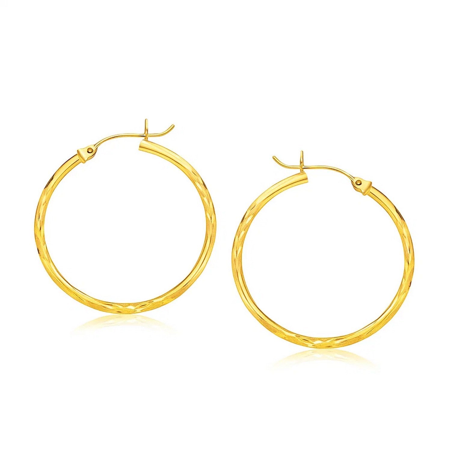 14k yellow gold diamond cut large hoop earrings, modern design with a sleek, elegant finish for a luxurious look.
