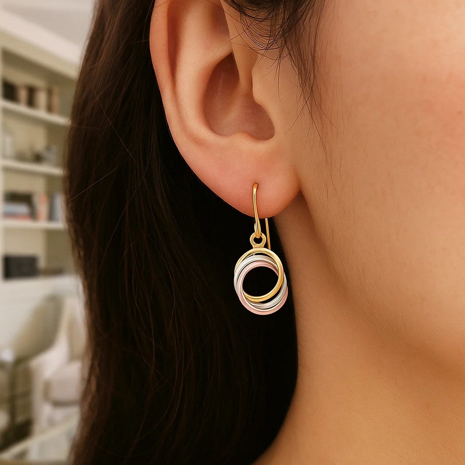 14k tri-color gold open entwined dangle earrings showcasing a modern design with elegant movement and luxurious shine