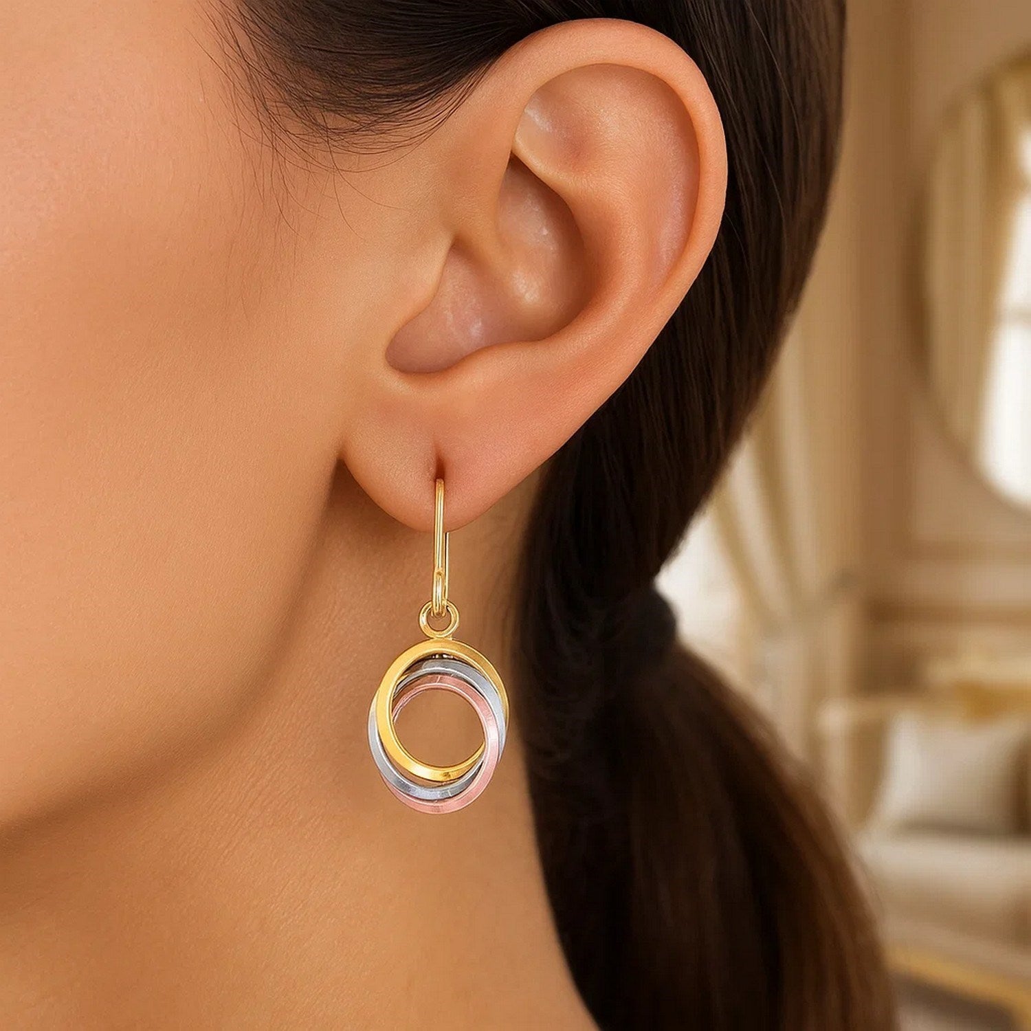 14k tri-color gold open entwined dangle earrings with a modern design, showcasing exquisite craftsmanship and elegance.