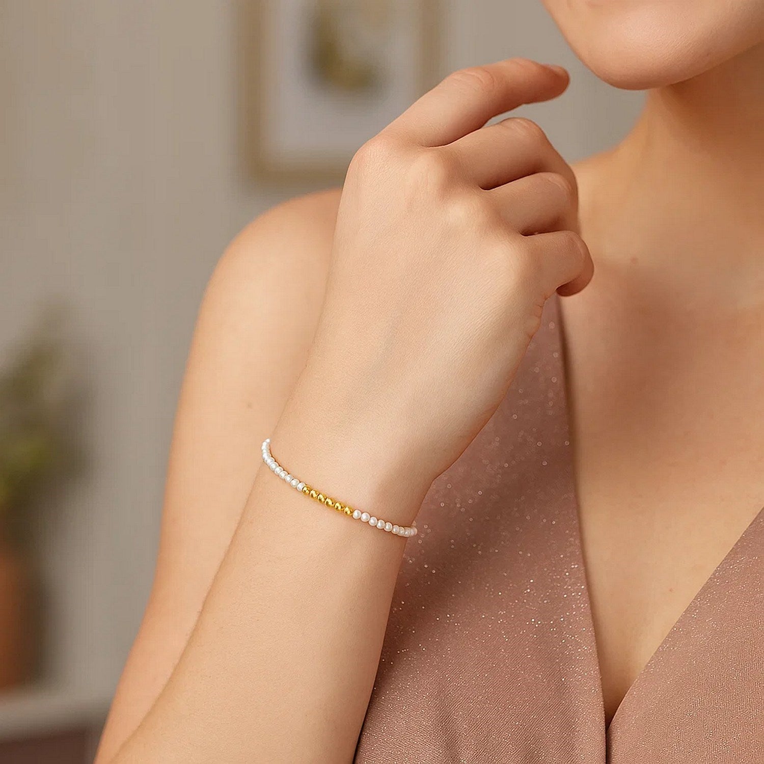 14k yellow gold high polish bracelet adorned with elegant freshwater pearls and pallina bead design.