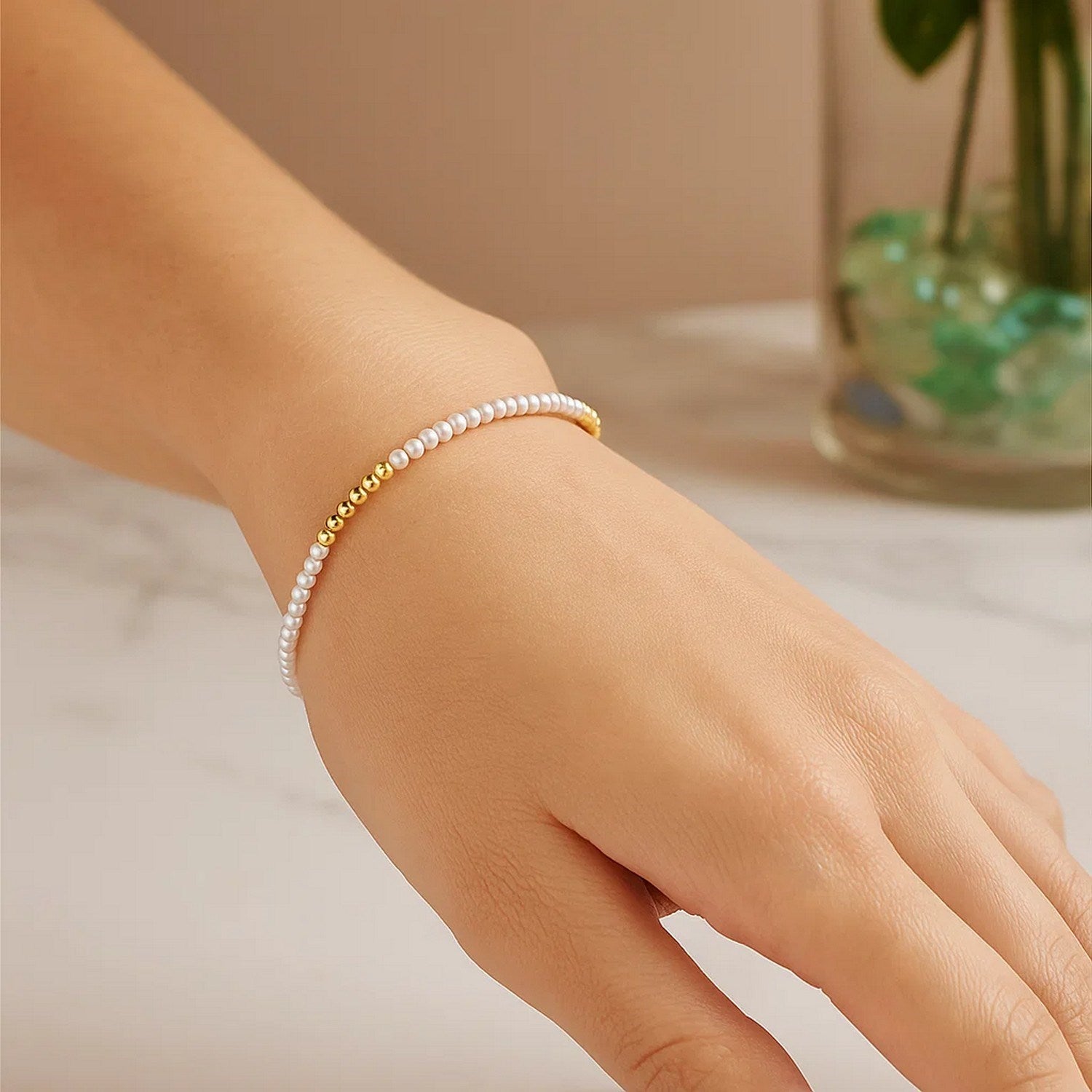 14k yellow gold high polish bracelet featuring elegant freshwater pearl pallina beads, perfect for refined style.