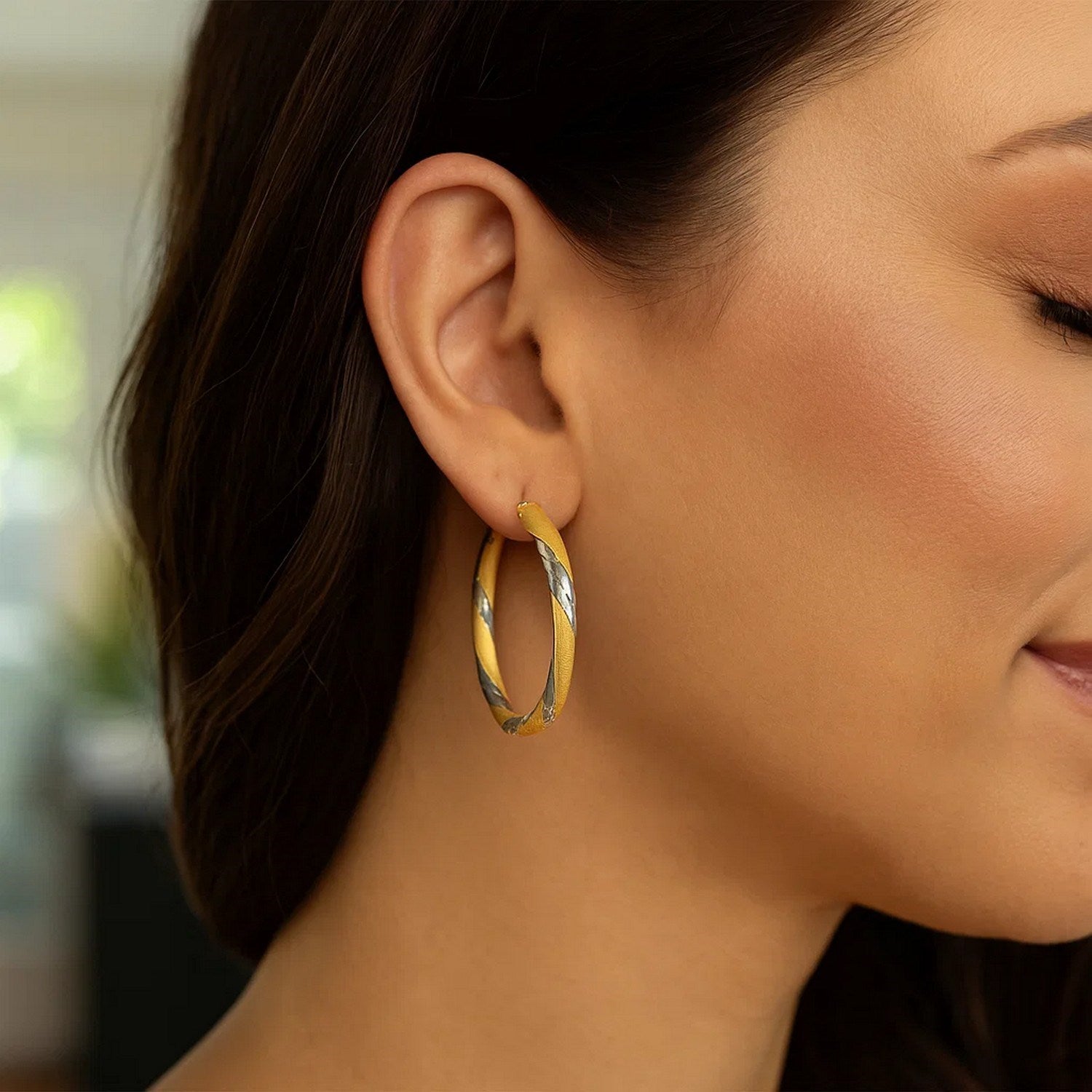 14k two-tone gold polished hoop earrings with a modern design, showcasing elegance and luxury for any occasion.