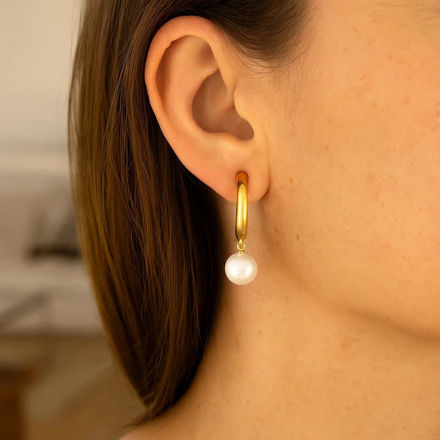 14k yellow gold polished half hoop earrings featuring lustrous pearls in a modern design, perfect for elegant occasions.