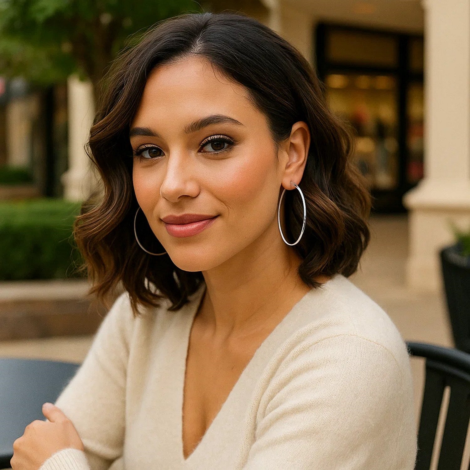 Polished 14k white gold hoop earrings with a modern design, showcasing elegance and timeless sophistication.