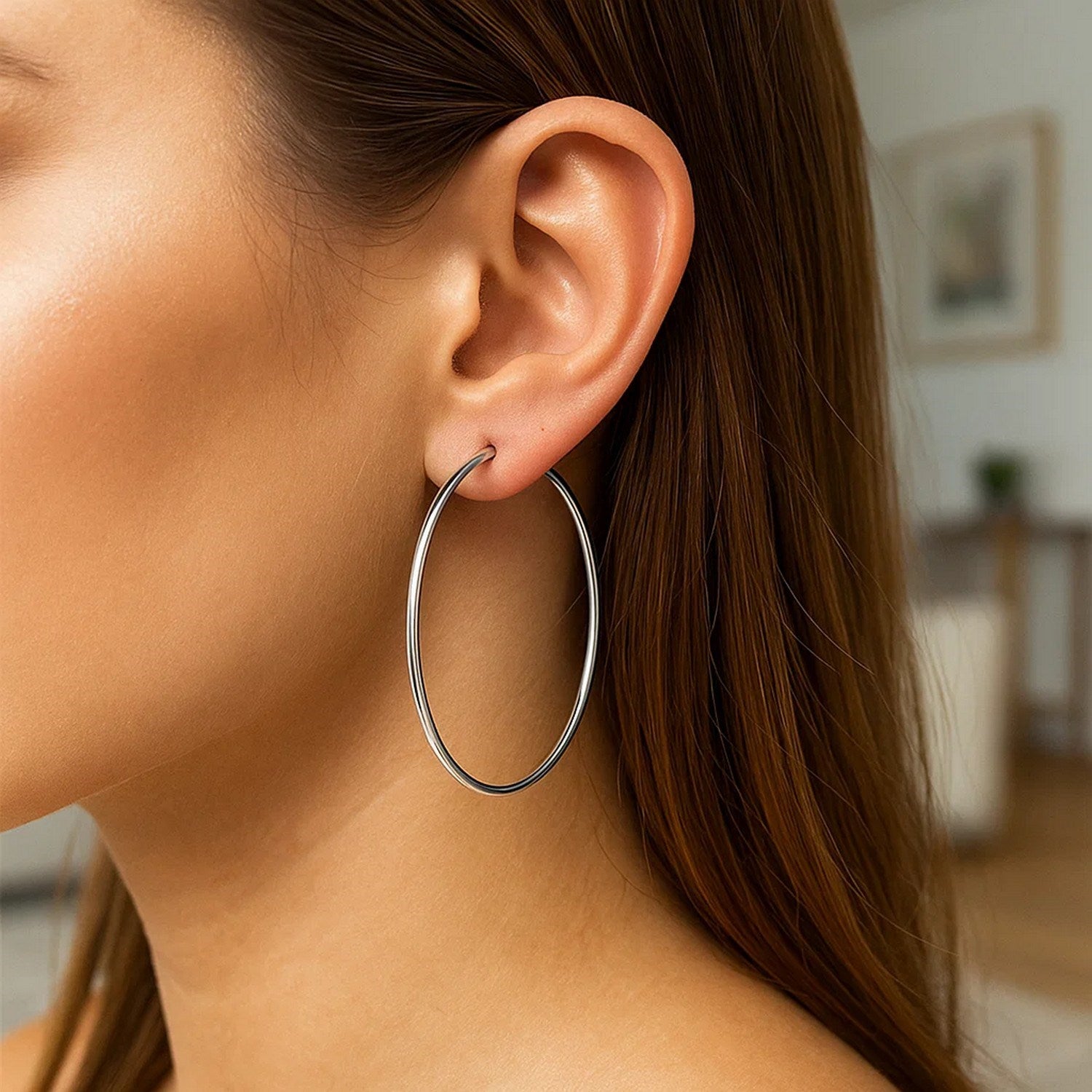 Polished 14k white gold modern hoop earrings showcasing elegant craftsmanship and timeless design.