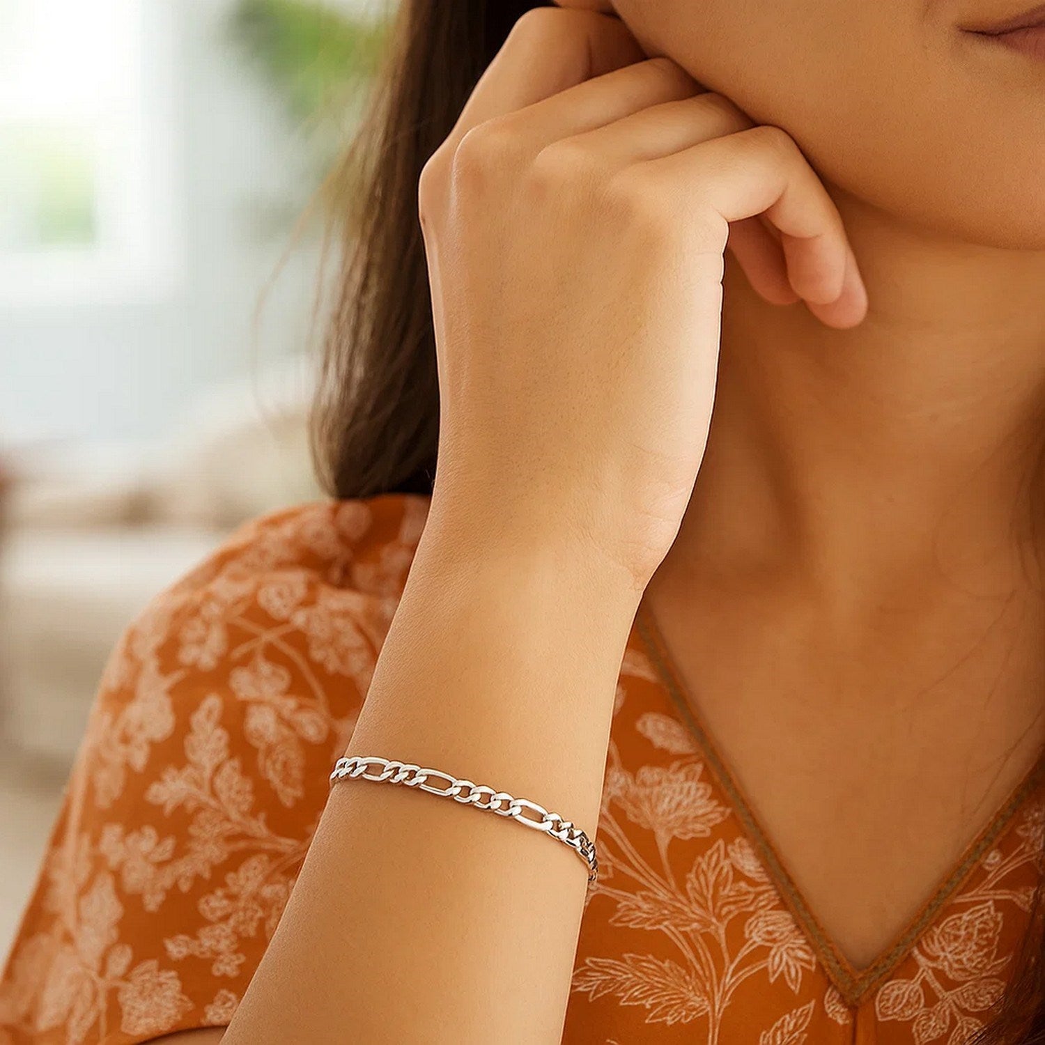 14k white gold solid Figaro bracelet featuring elegant links, embodying classic luxury and timeless style.