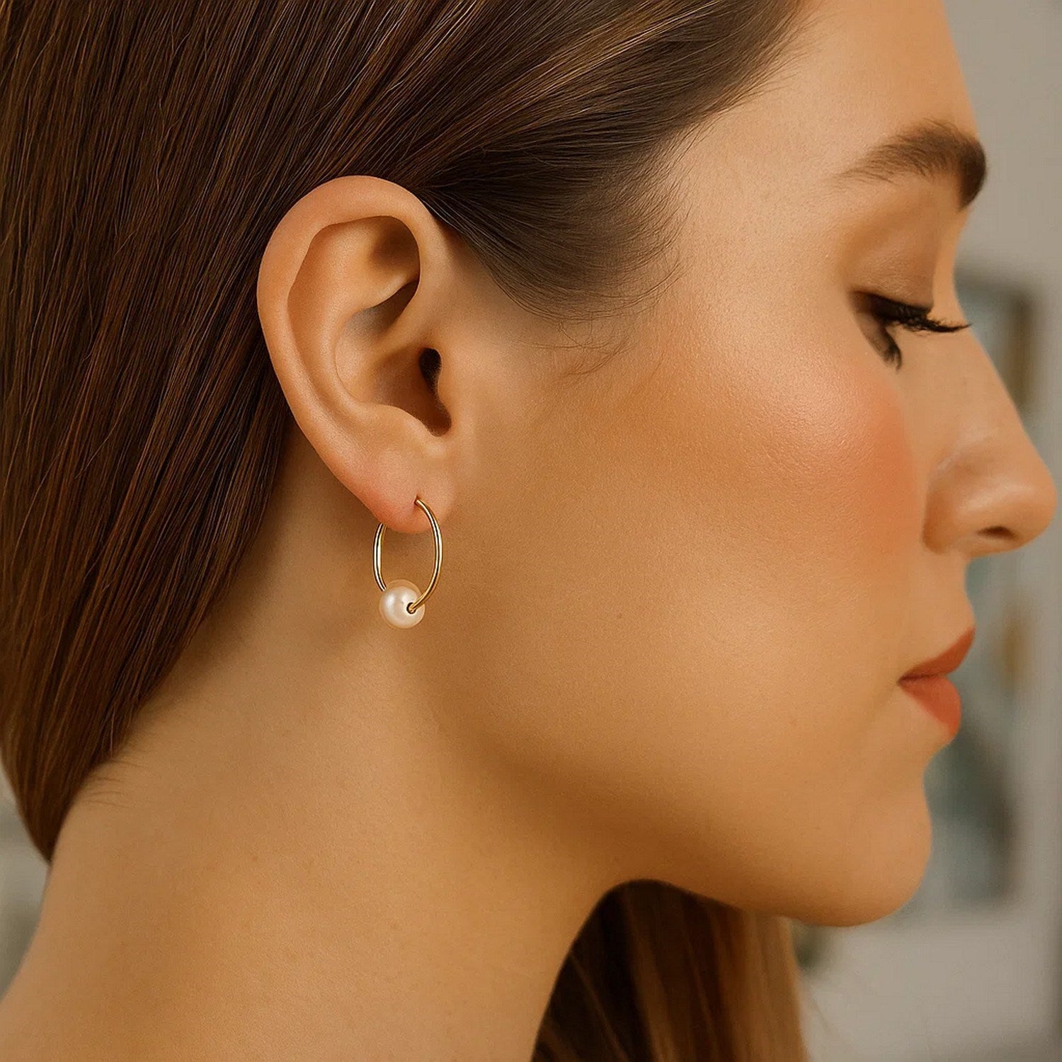 14k yellow gold modern hoop earrings featuring lustrous round pearls for an elegant touch.