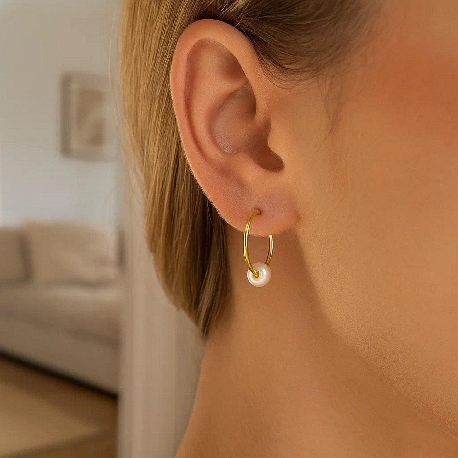 14k yellow gold modern hoop earrings featuring lustrous round pearls for an elegant touch.