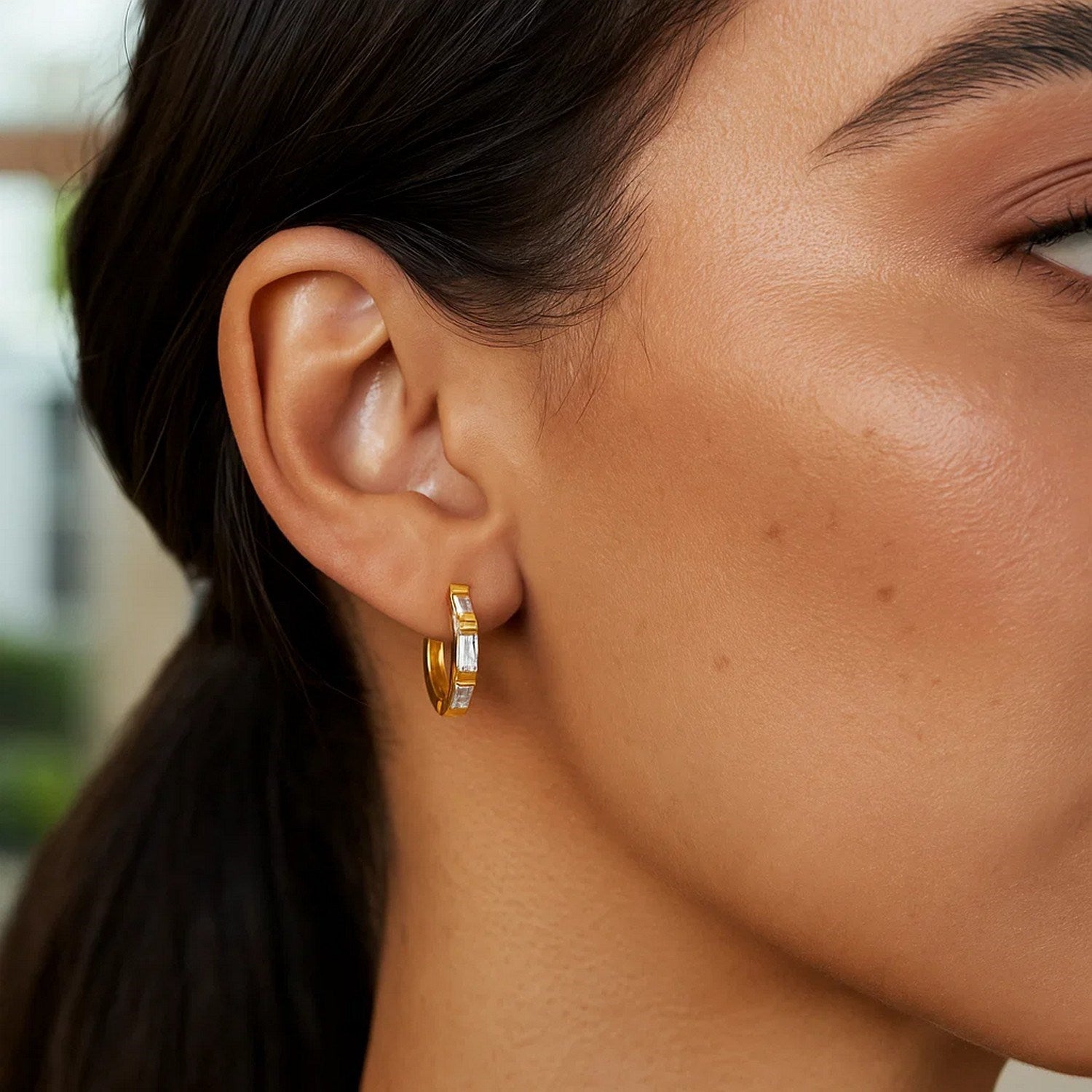 14k yellow gold petite octagonal hoop earrings adorned with sparkling cubic zirconias for a modern elegance.