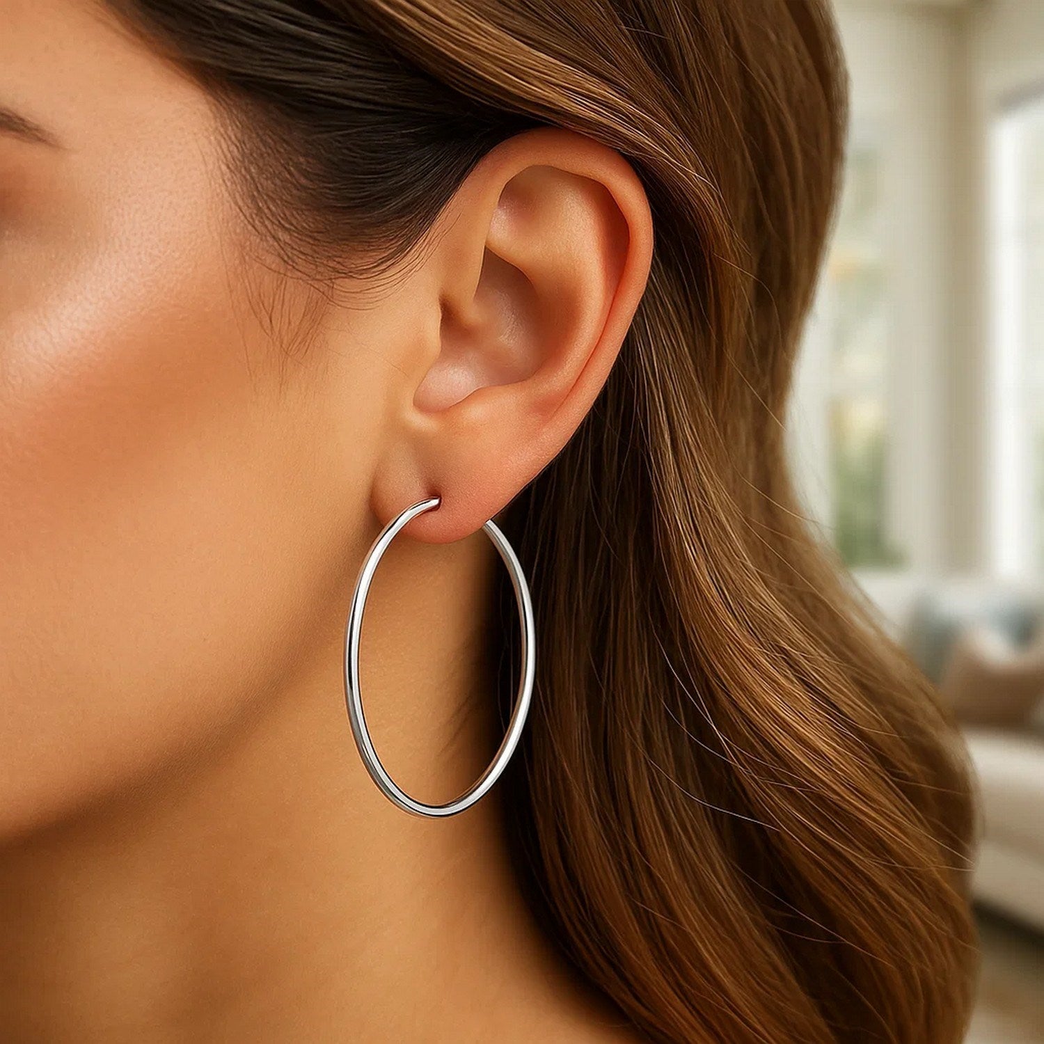 14k white gold polished hoop earrings with a sleek modern design, perfect for elegant everyday wear.