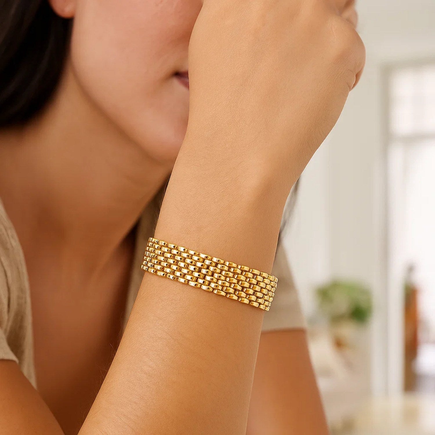 14k yellow gold flexible panther line bracelet with modern link design, showcasing luxury and elegance.