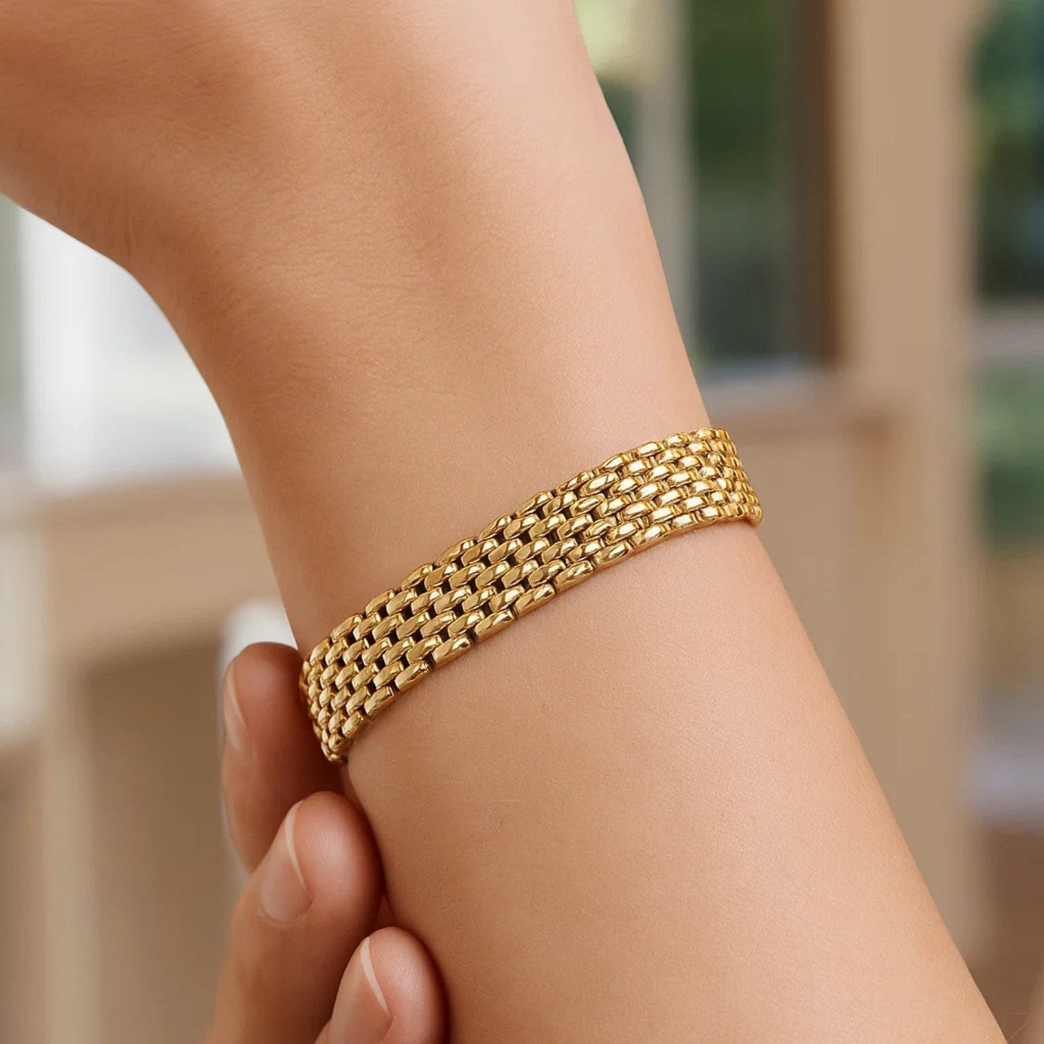 14k yellow gold flexible panther line bracelet with modern link design, showcasing luxurious elegance and craftsmanship.