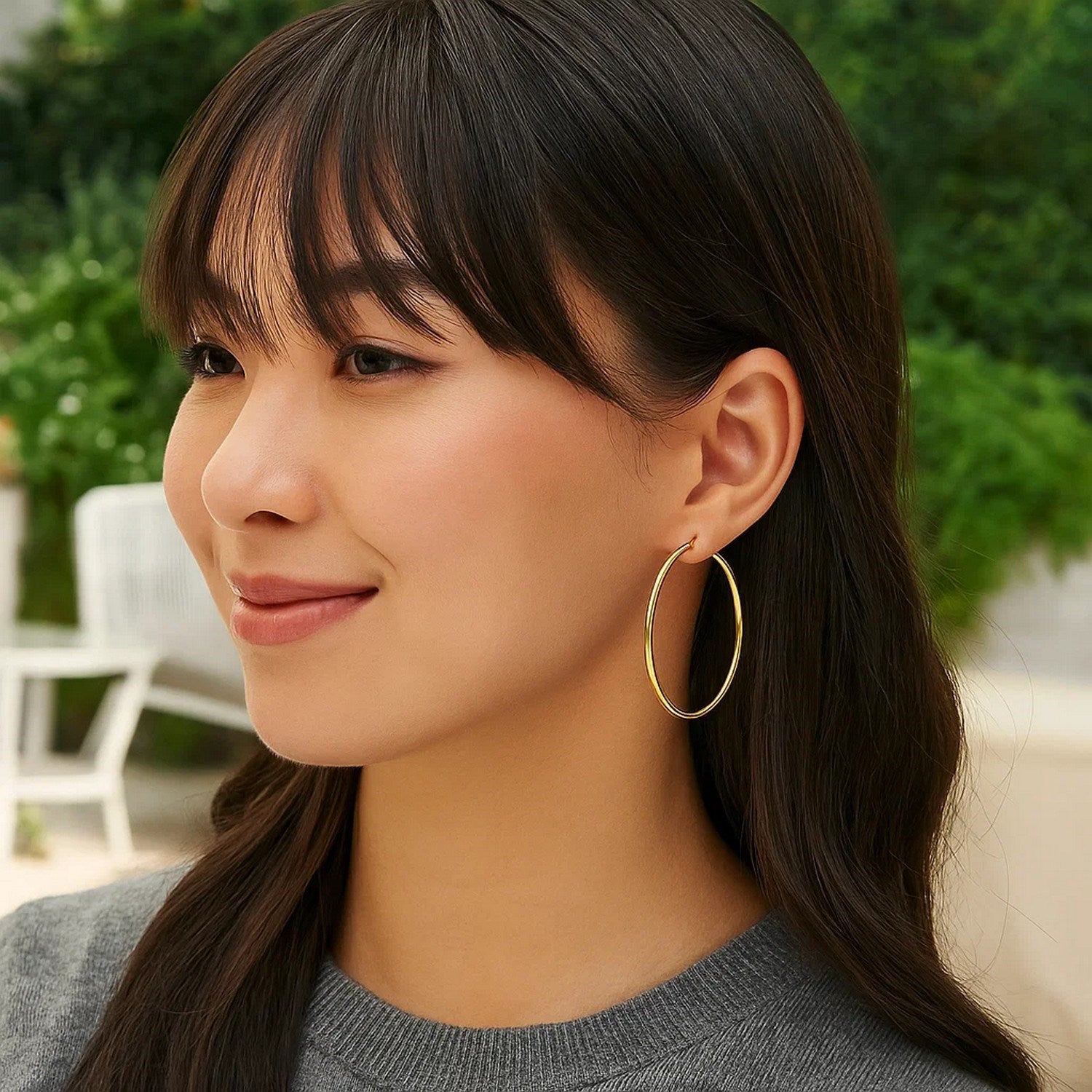 14k yellow gold polished hoop earrings, modern design, showcasing elegance and sophistication in every detail.