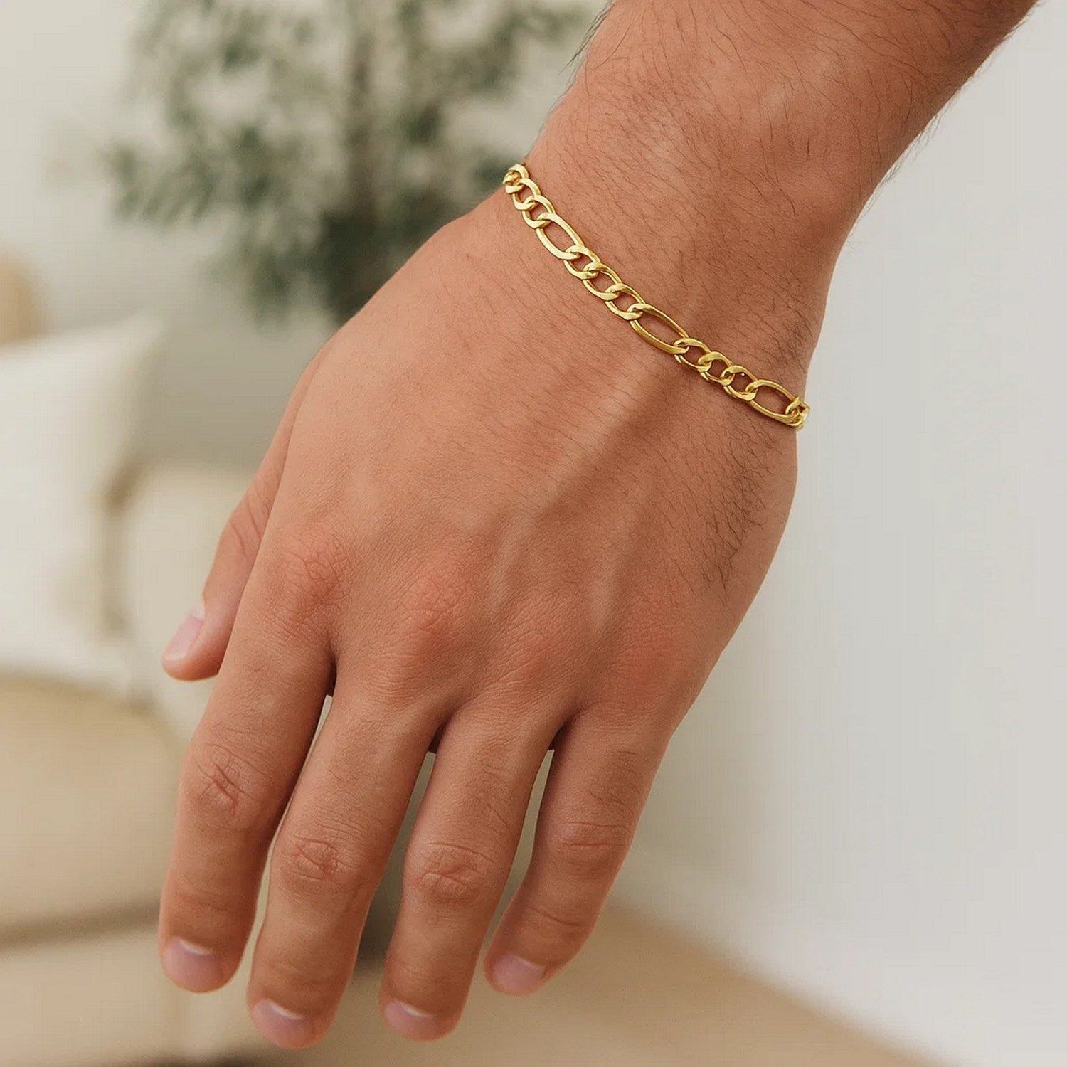 14k yellow gold solid Figaro bracelet with modern design, featuring elegant round links and polished finish.