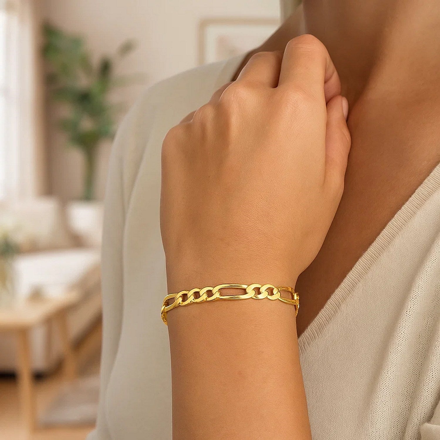 14k yellow gold solid Figaro bracelet featuring a modern design with elegant round links, perfect for luxury styling.
