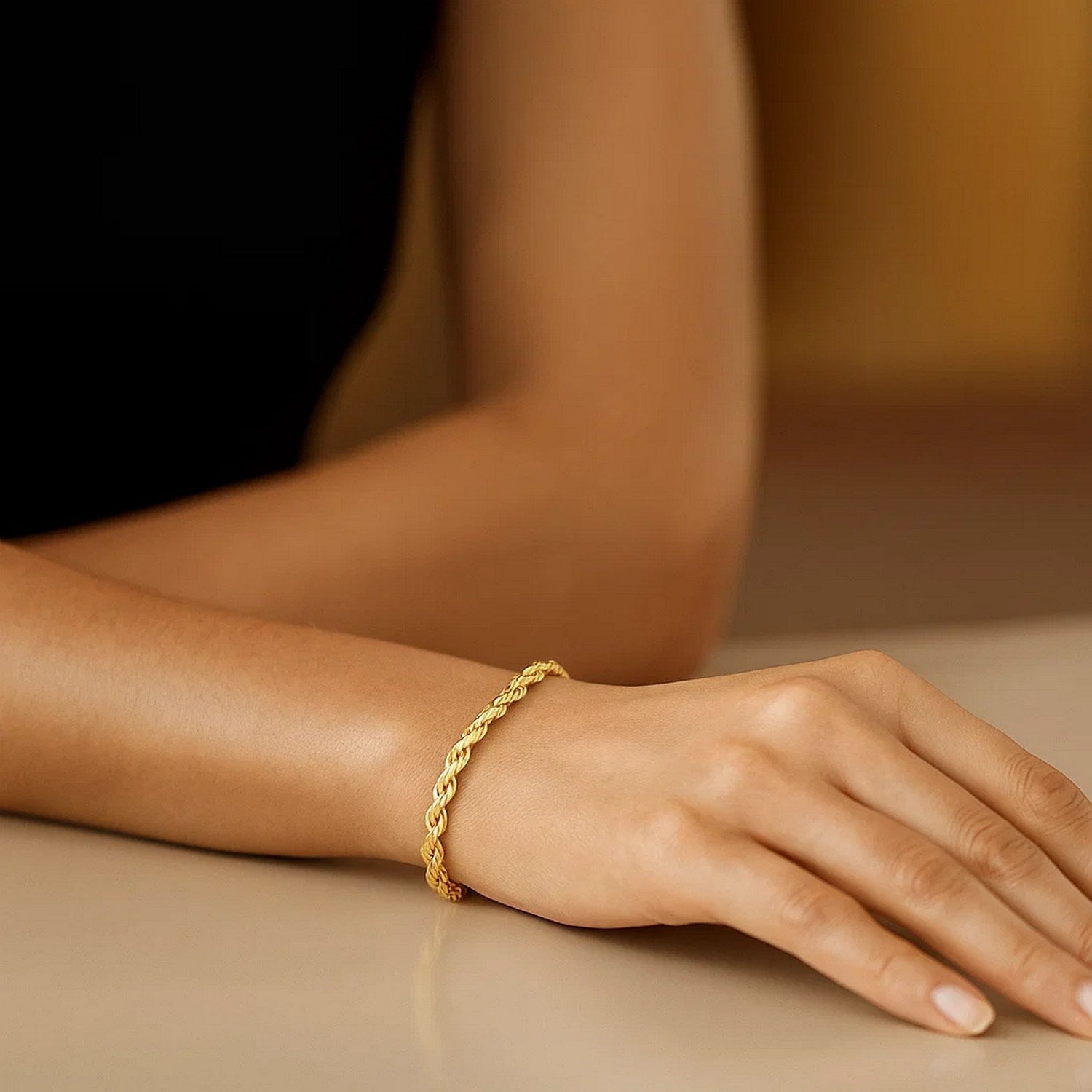 14k yellow gold solid rope bracelet featuring a modern link design, perfect for elegant layering or standalone wear.