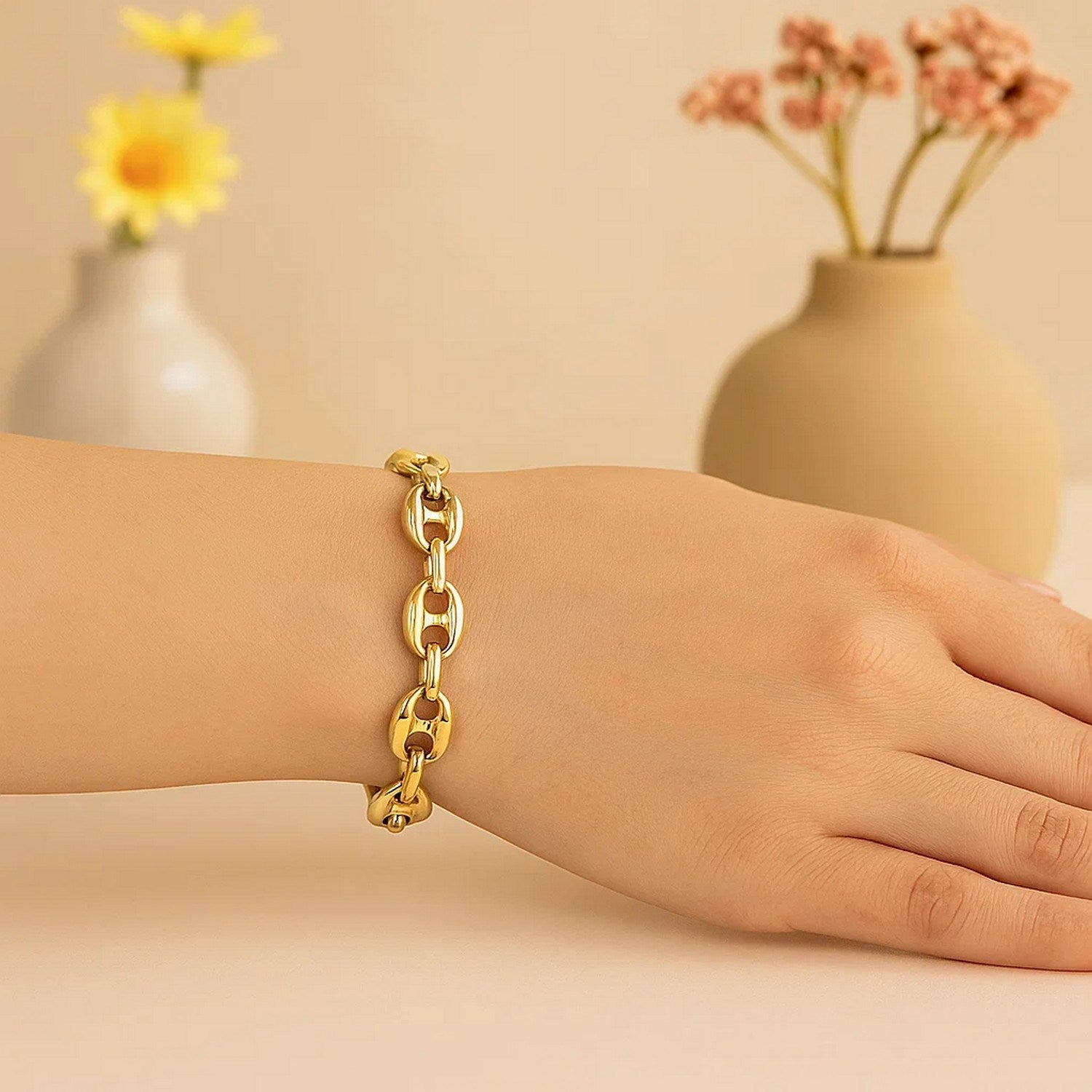 14k yellow gold puffed mariner link bracelet with modern design, showcasing elegant, interlocking links.