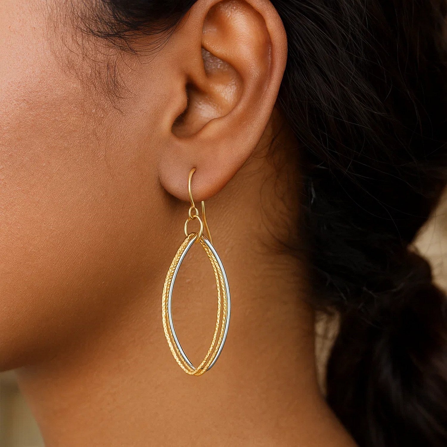 14k two-tone gold textured triple oval drop earrings, showcasing contemporary elegance and luxurious craftsmanship.