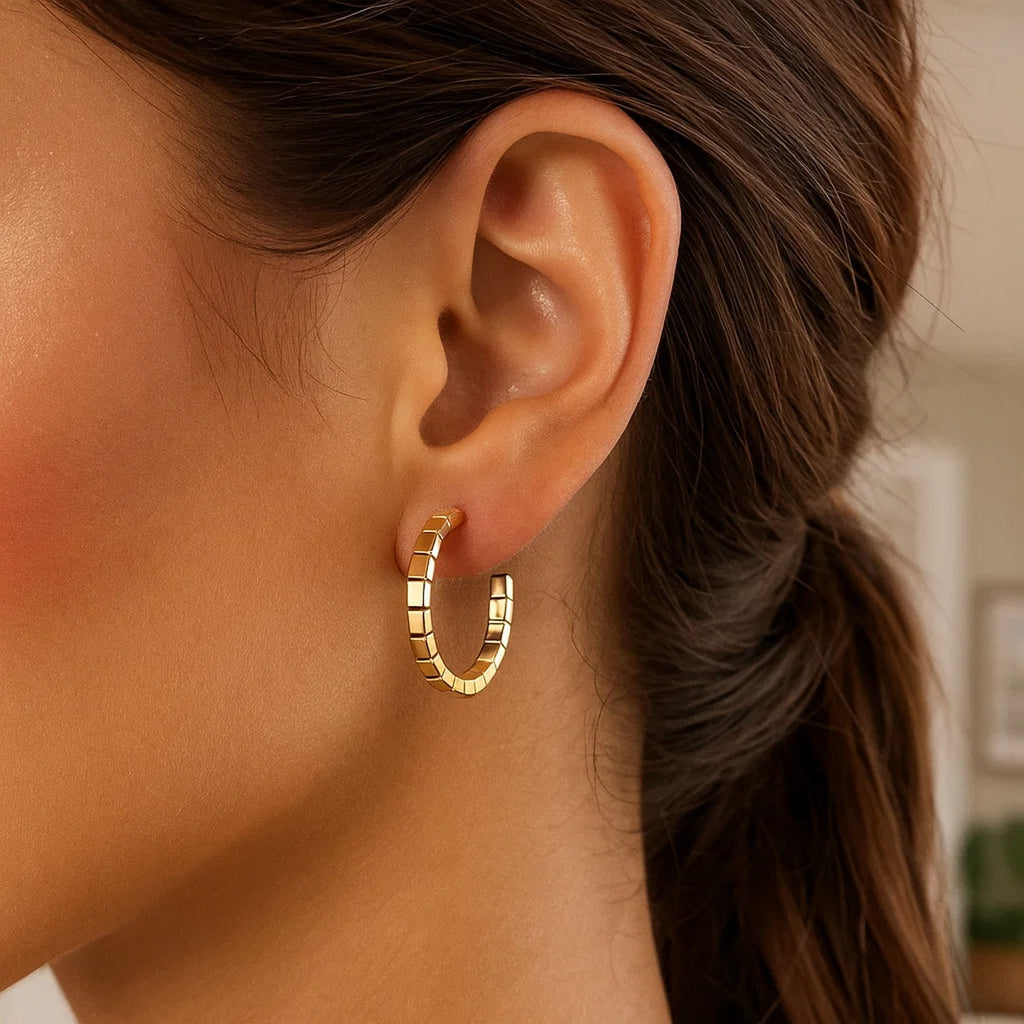 14k yellow gold polished hoop earrings with a sleek modern design, perfect for elegant everyday wear.