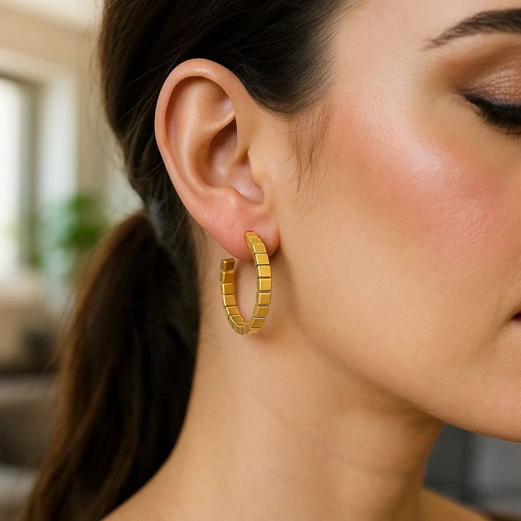 14k yellow gold polished hoop earrings with a sleek modern design, perfect for elegant everyday wear.