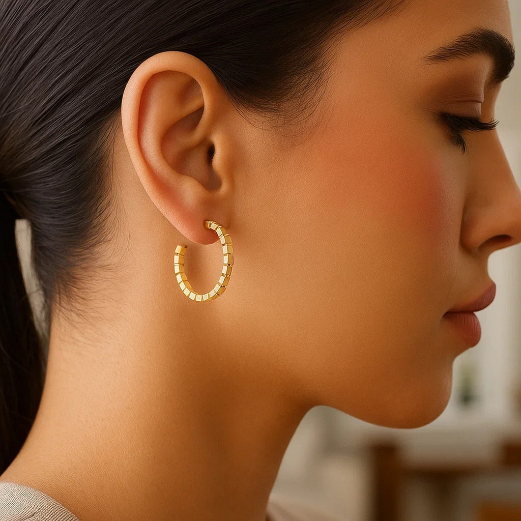 14k yellow gold polished hoop earrings with a sleek modern design, perfect for elegant everyday wear.