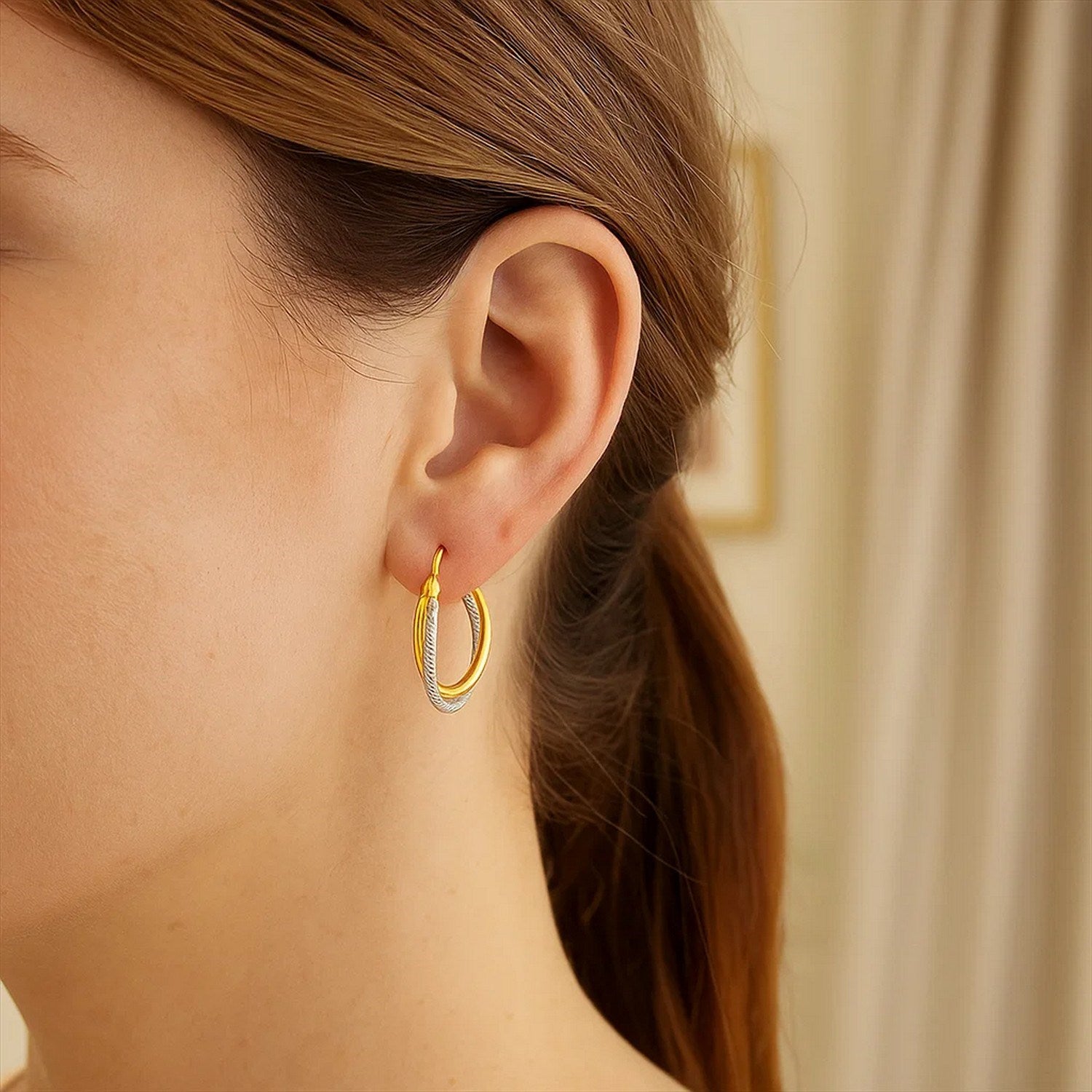 14k two-tone gold textured polished hoop earrings, showcasing modern elegance and luxurious craftsmanship.