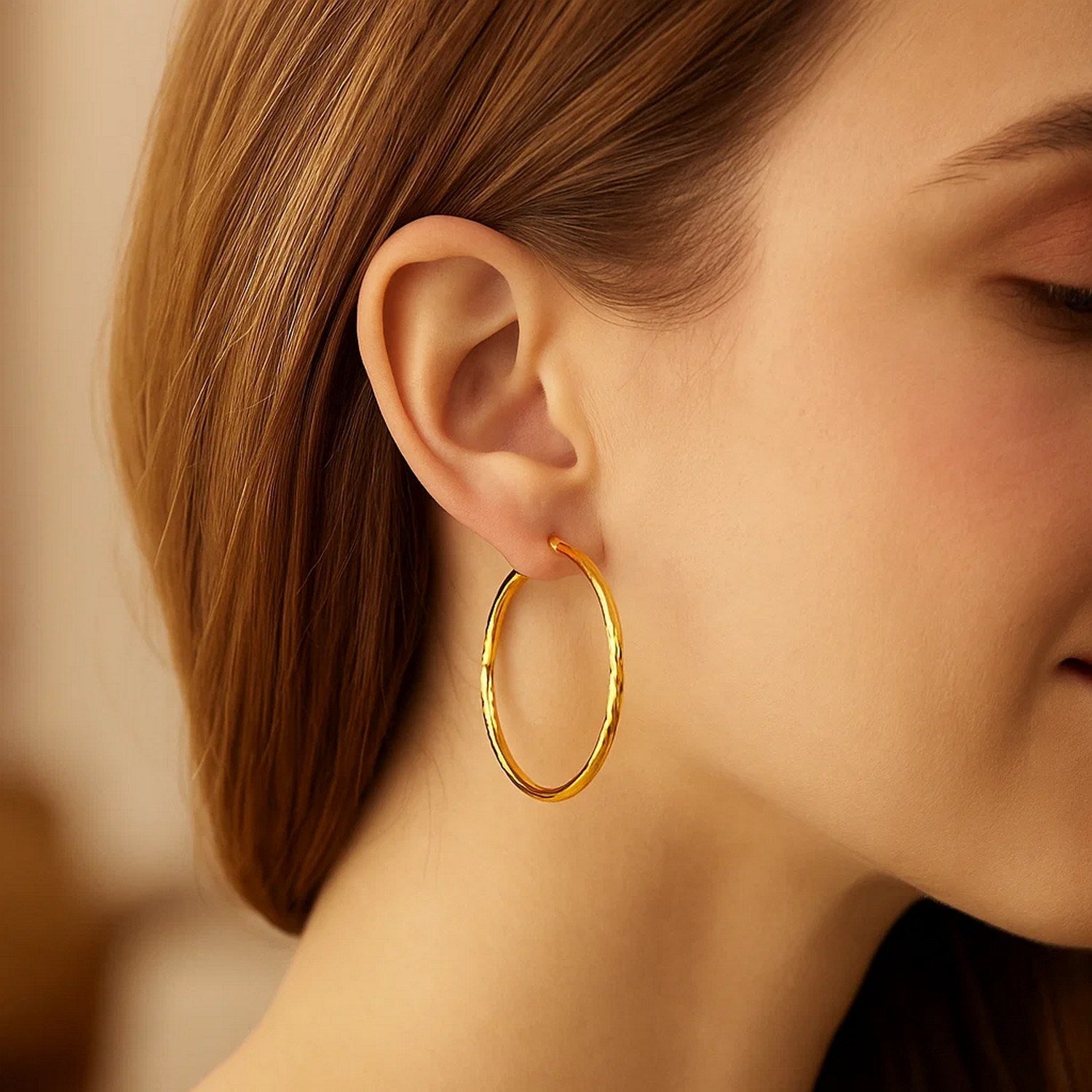Elegant 14k yellow gold extra large hoop earrings featuring a stunning diamond cut design for a luxurious touch.