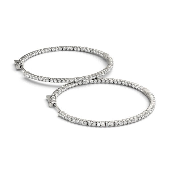 14k white gold polished hoop earrings featuring round diamonds in a modern prong setting, showcasing elegance and luxury.