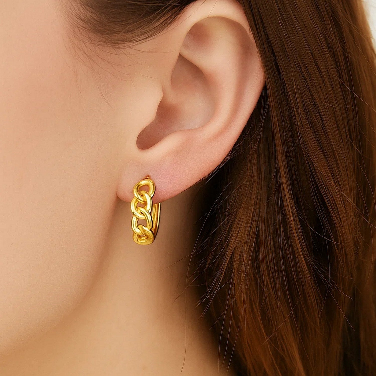 14k yellow gold huggie hoop earrings with a sleek modern design, perfect for everyday elegance.