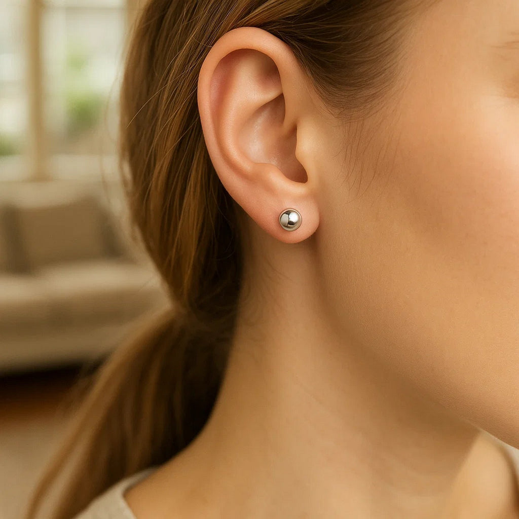 14k white gold classic round stud earrings featuring a sleek modern design, perfect for elegant everyday wear.
