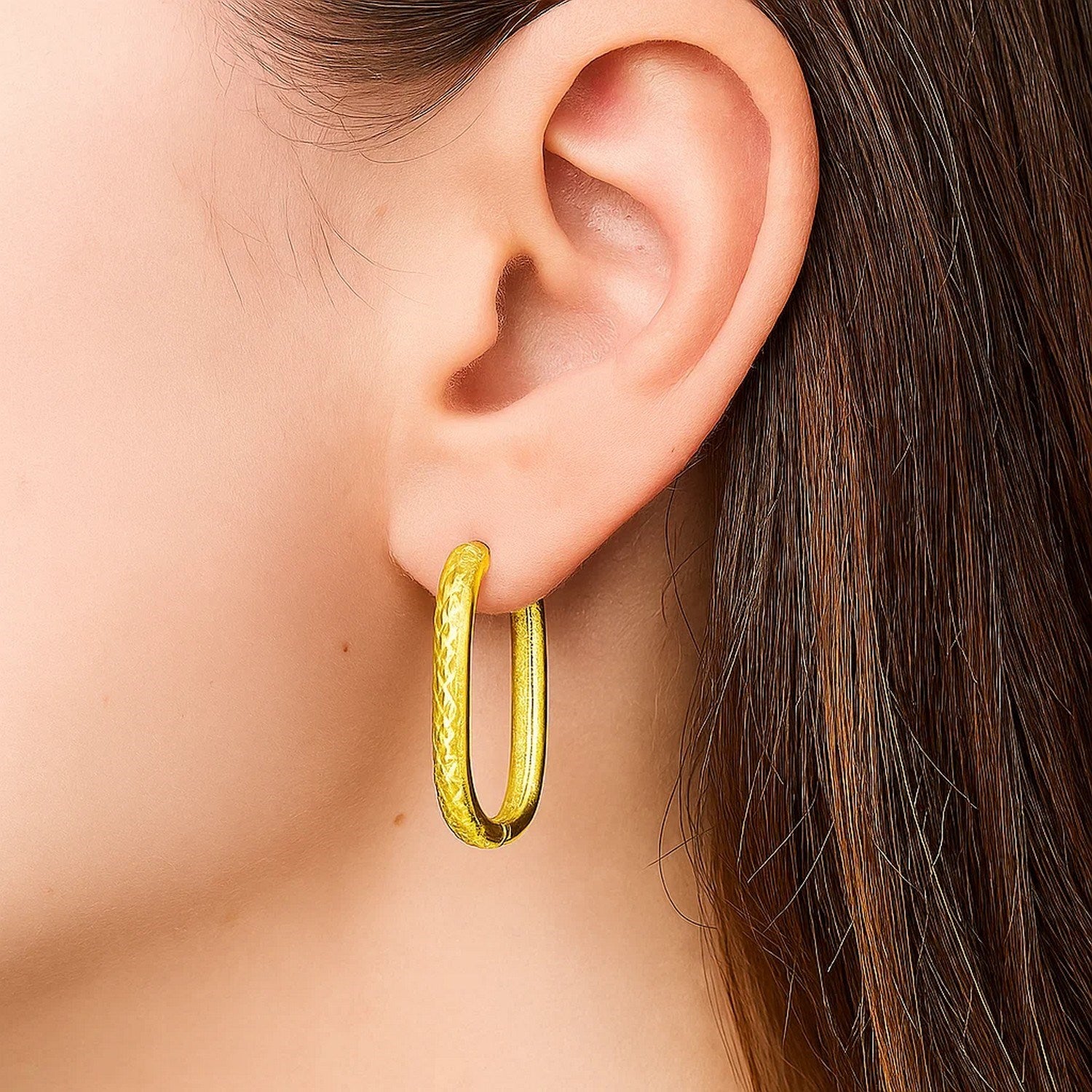 14K yellow gold modern hoop earrings featuring exquisite engraved details and sparkling diamonds.