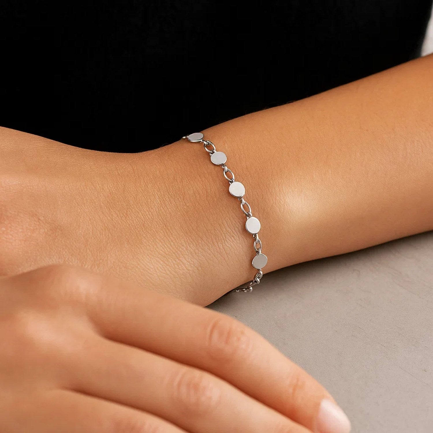 14k white gold bracelet featuring polished circles in a modern chain design, perfect for elegant layering.