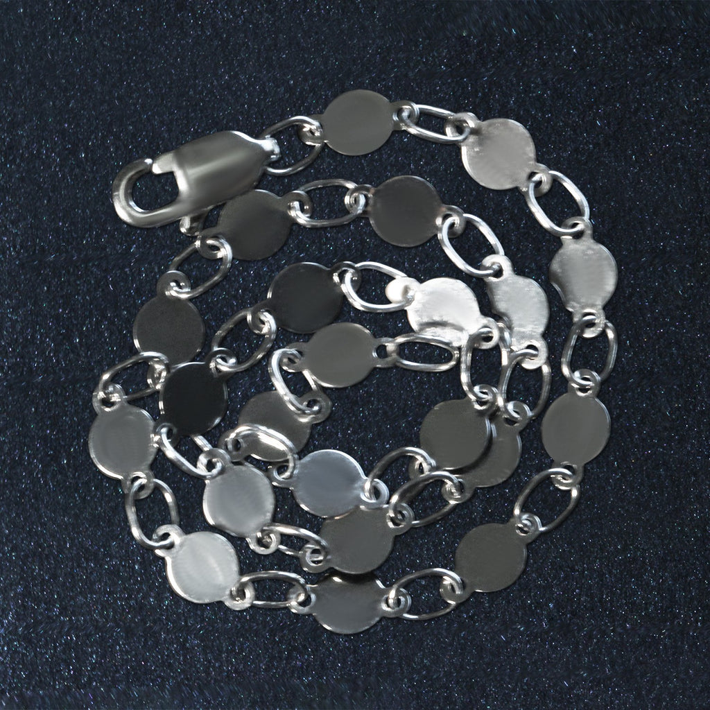 14k white gold bracelet featuring polished circles in a modern chain design, perfect for elegant layering.