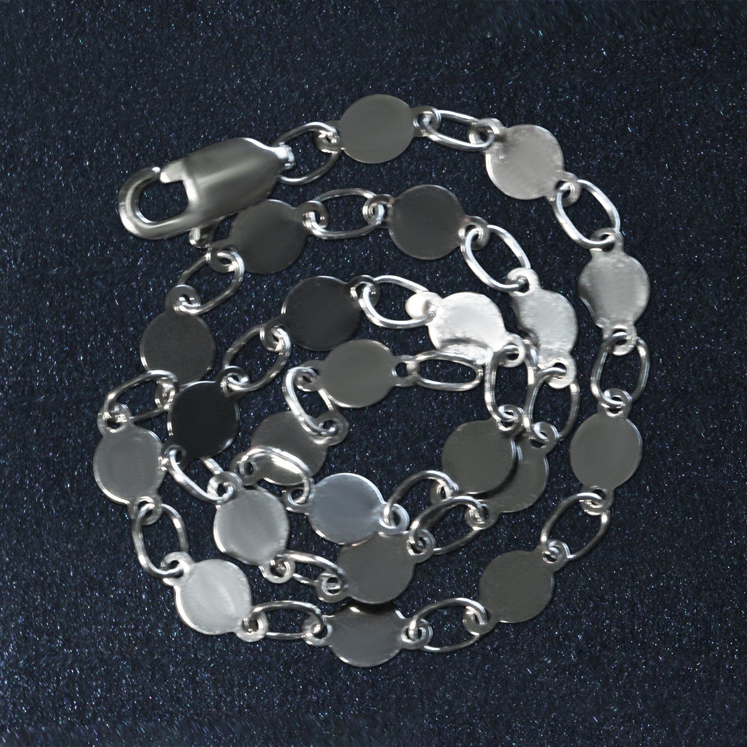 14k white gold bracelet featuring polished circles in a modern chain design, perfect for elegant layering.