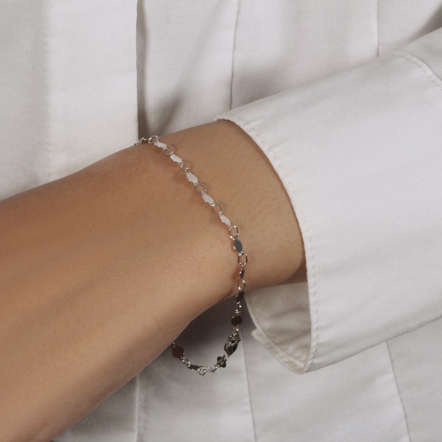 14k white gold bracelet featuring polished circles in a modern chain design, perfect for elegant layering.