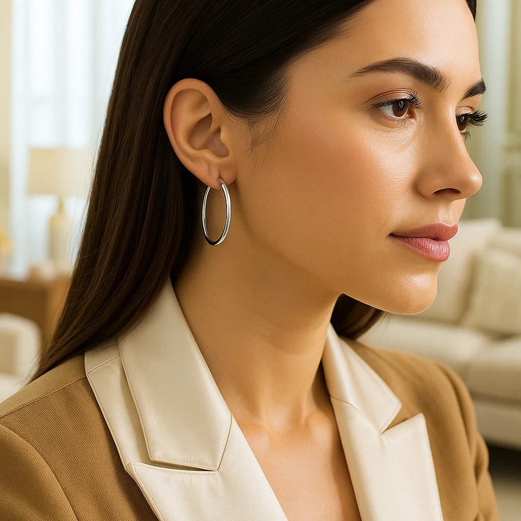 Polished 14k white gold hoop earrings with a modern design, showcasing elegance and timeless sophistication.