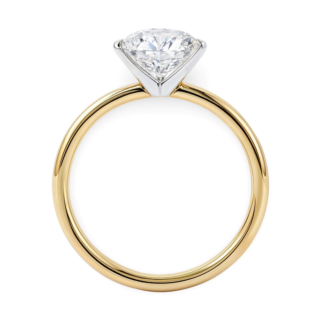1 1/2 carat round lab-grown diamond solitaire ring in 10K yellow gold, featuring a modern prong setting.