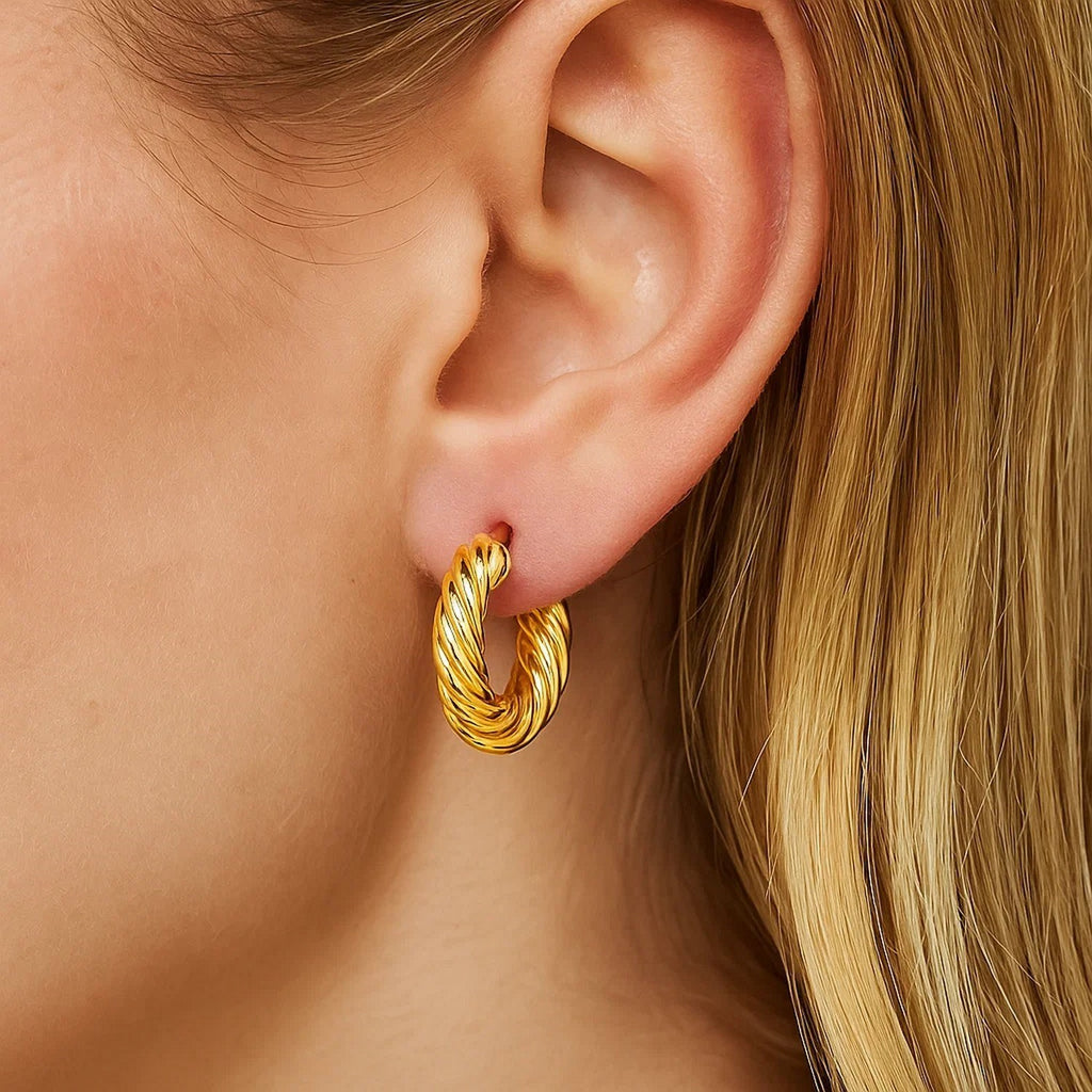 14k yellow gold twisted cable small hoop earrings exuding elegance and timeless sophistication.