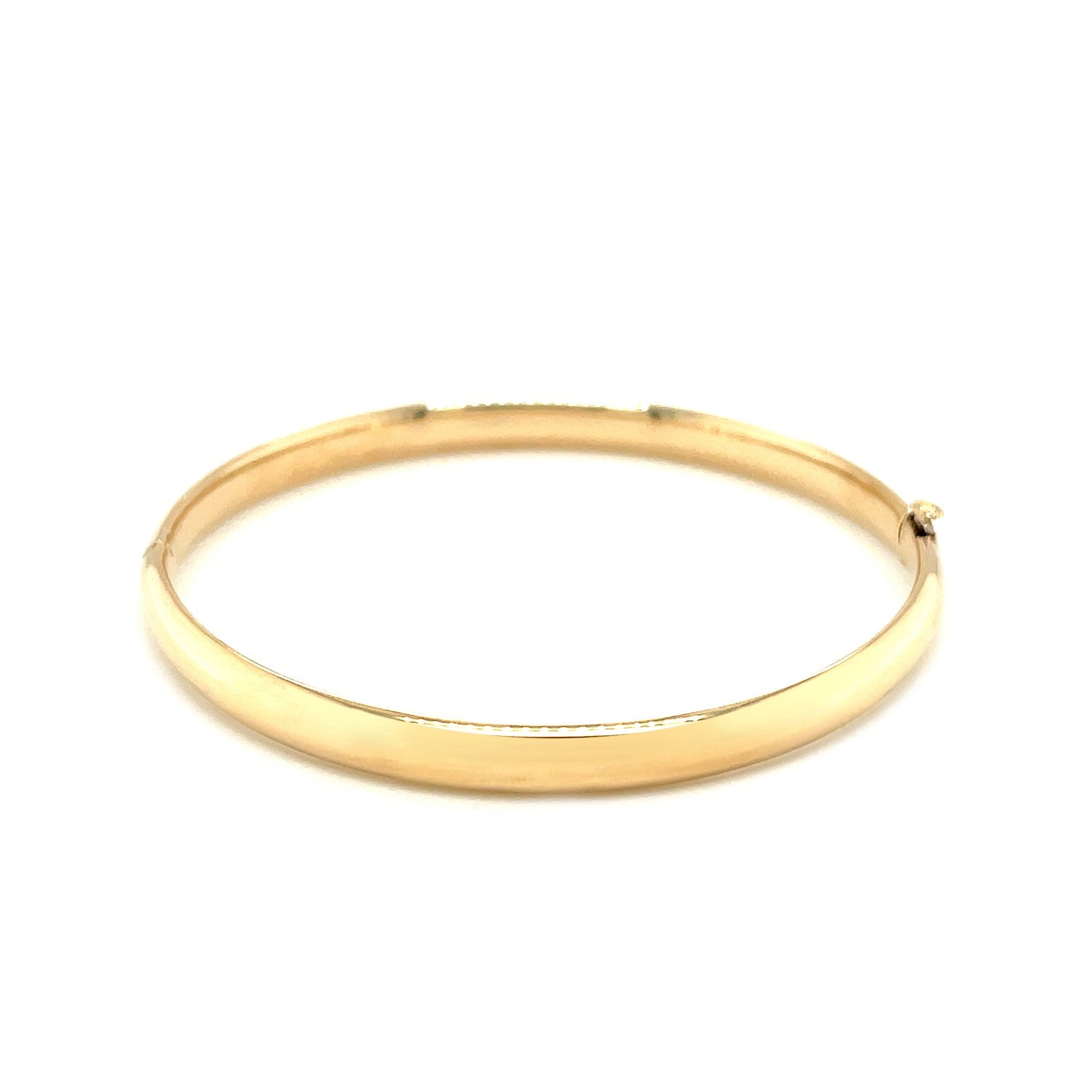14k yellow gold polished children's bangle with elegant dome design, perfect for luxury gifting and special occasions.
