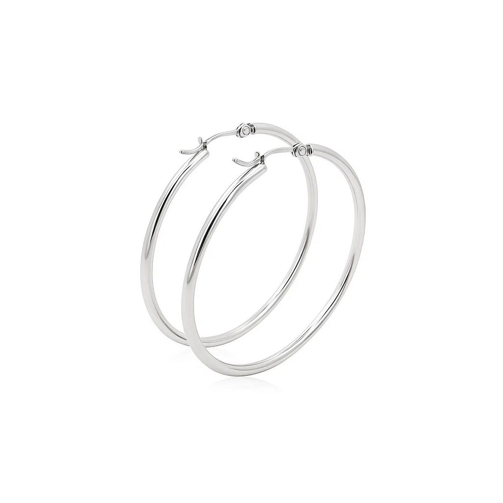 Polished 14k white gold hoop earrings showcasing a sleek modern design, perfect for elegant occasions.