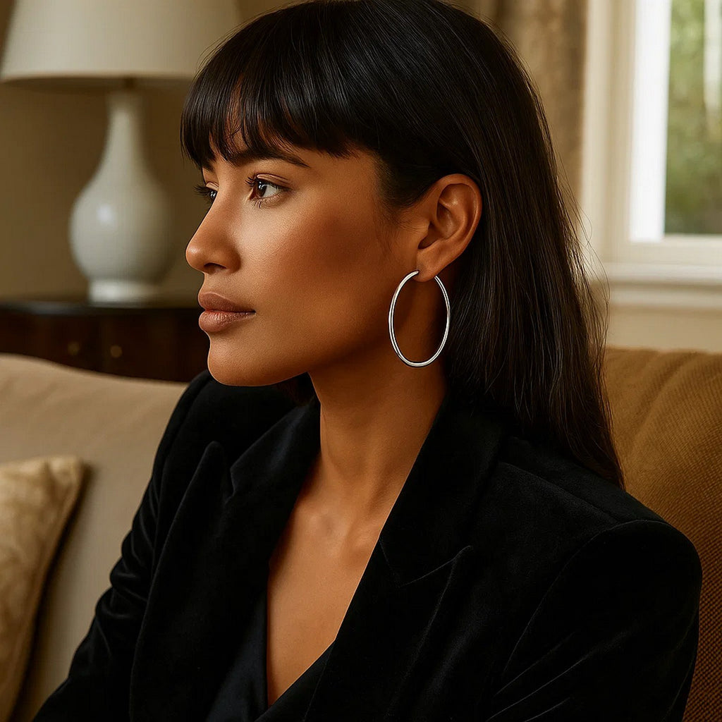 Polished 14k white gold hoop earrings showcasing a sleek modern design, perfect for elegant occasions.