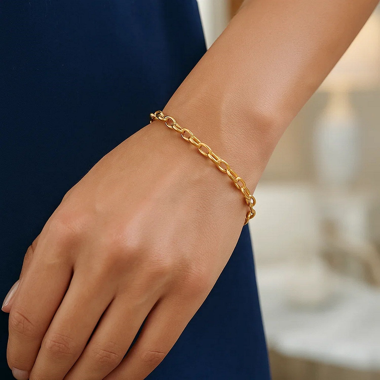 14k yellow gold oval rolo bracelet featuring a modern chain design, perfect for elegant layering or solo wear.