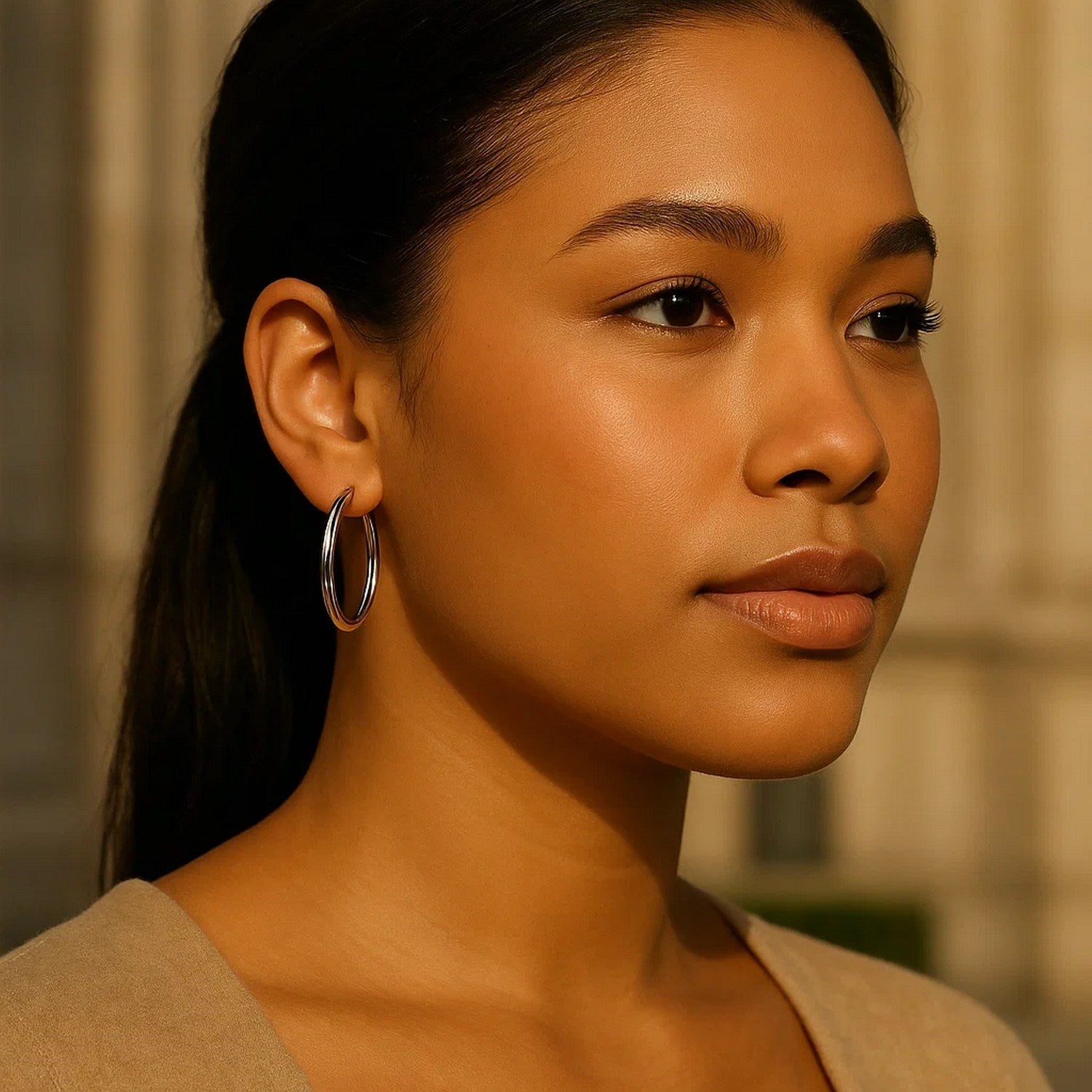 Polished 14k white gold hoop earrings with a modern design, showcasing elegance and timeless sophistication.