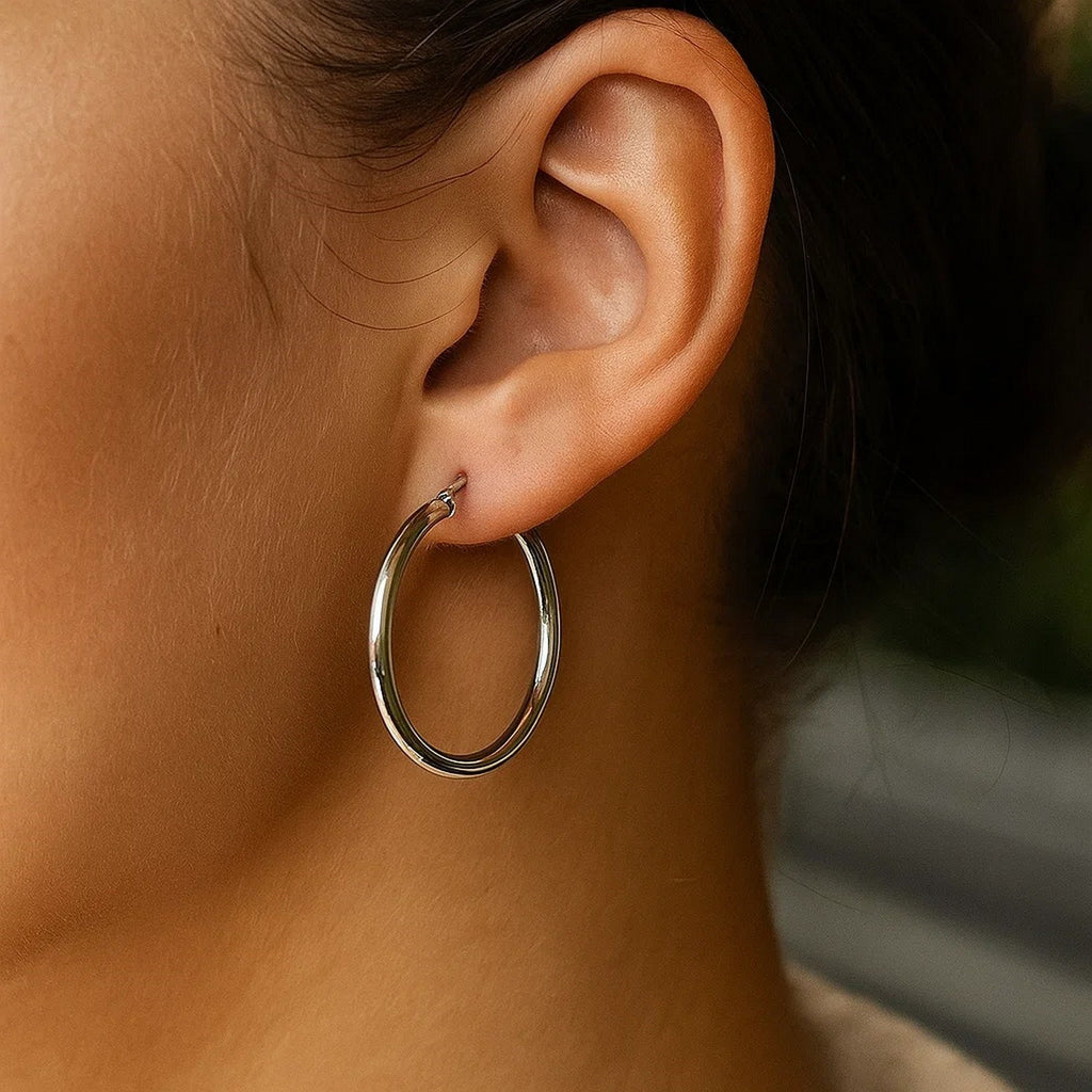 14k white gold polished hoop earrings with a sleek modern design, perfect for elegant everyday wear.