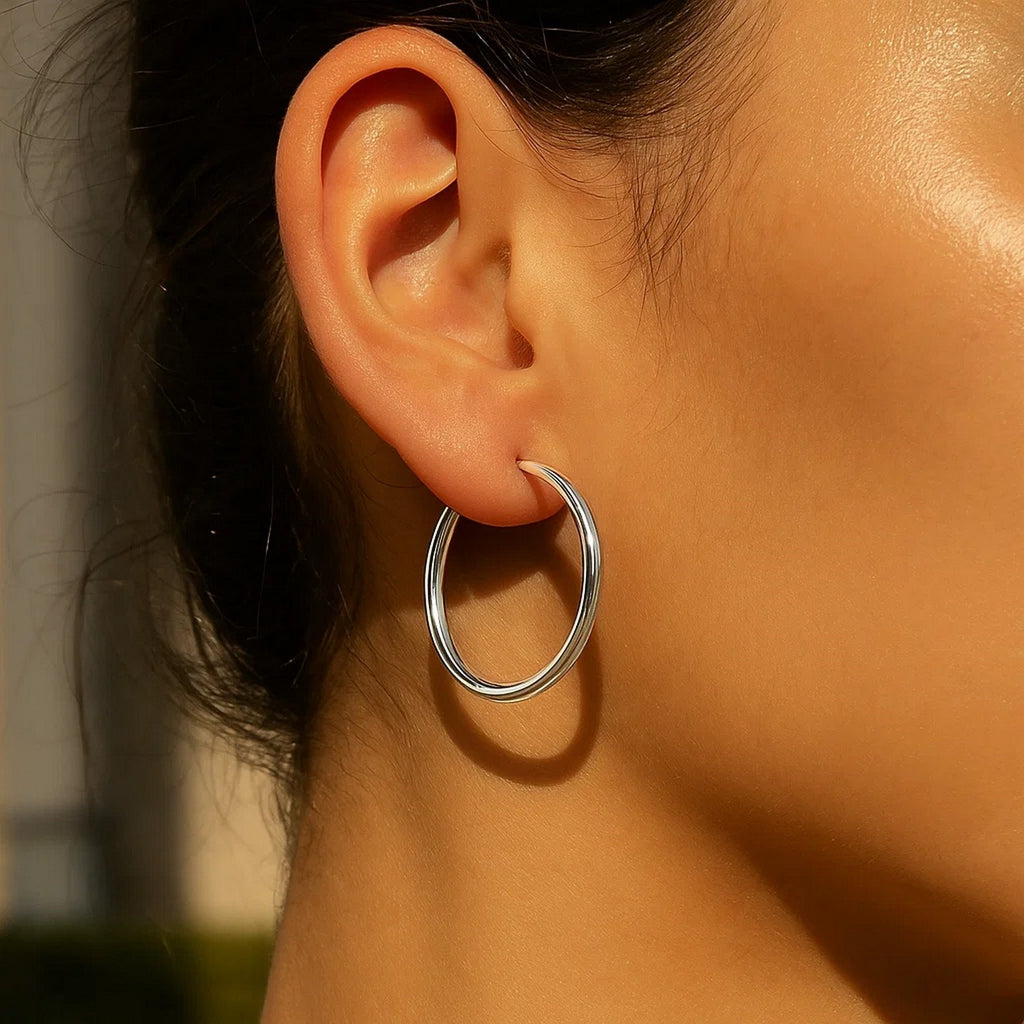 14k white gold polished hoop earrings with a sleek modern design, perfect for elegant everyday wear.