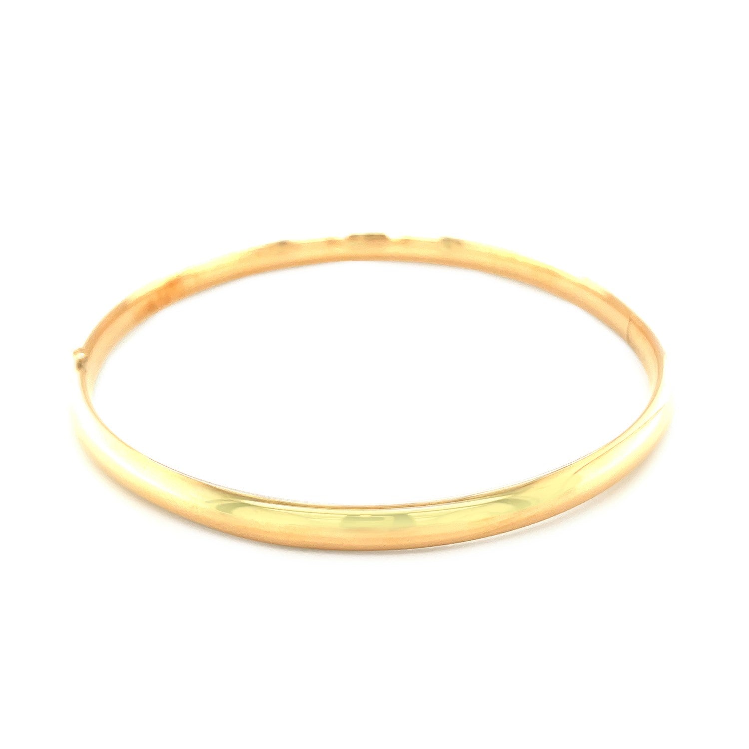 Classic 14k yellow gold bangle featuring a sleek design, perfect for elegant stacking or solo wear.