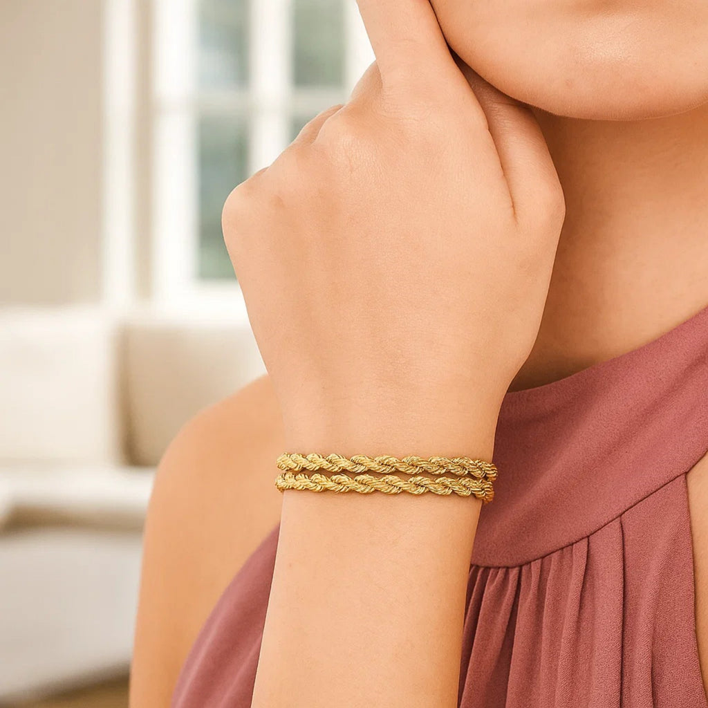 14k yellow gold dual row rope bracelet showcasing elegant design and luxurious craftsmanship, perfect for any occasion.