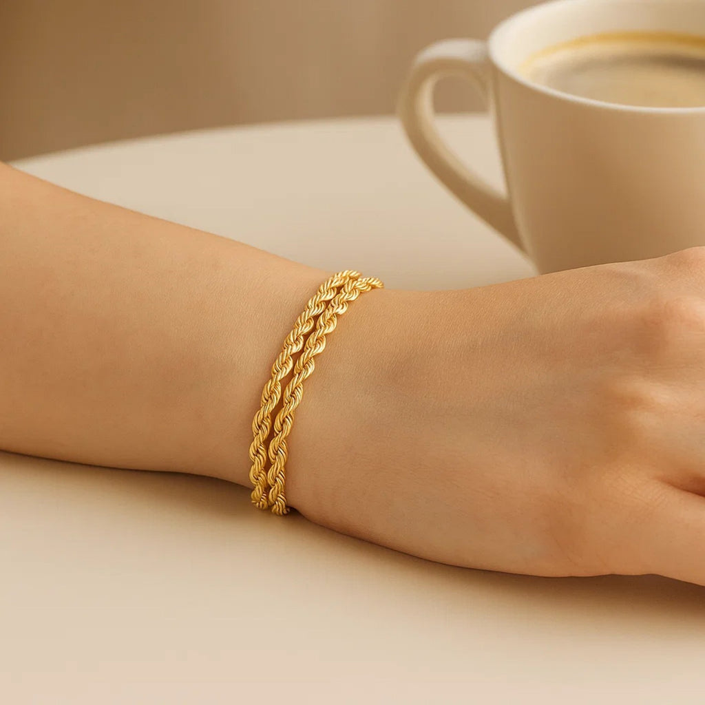 14k yellow gold dual row rope bracelet, elegantly crafted with a luxurious twist design for a timeless appeal.