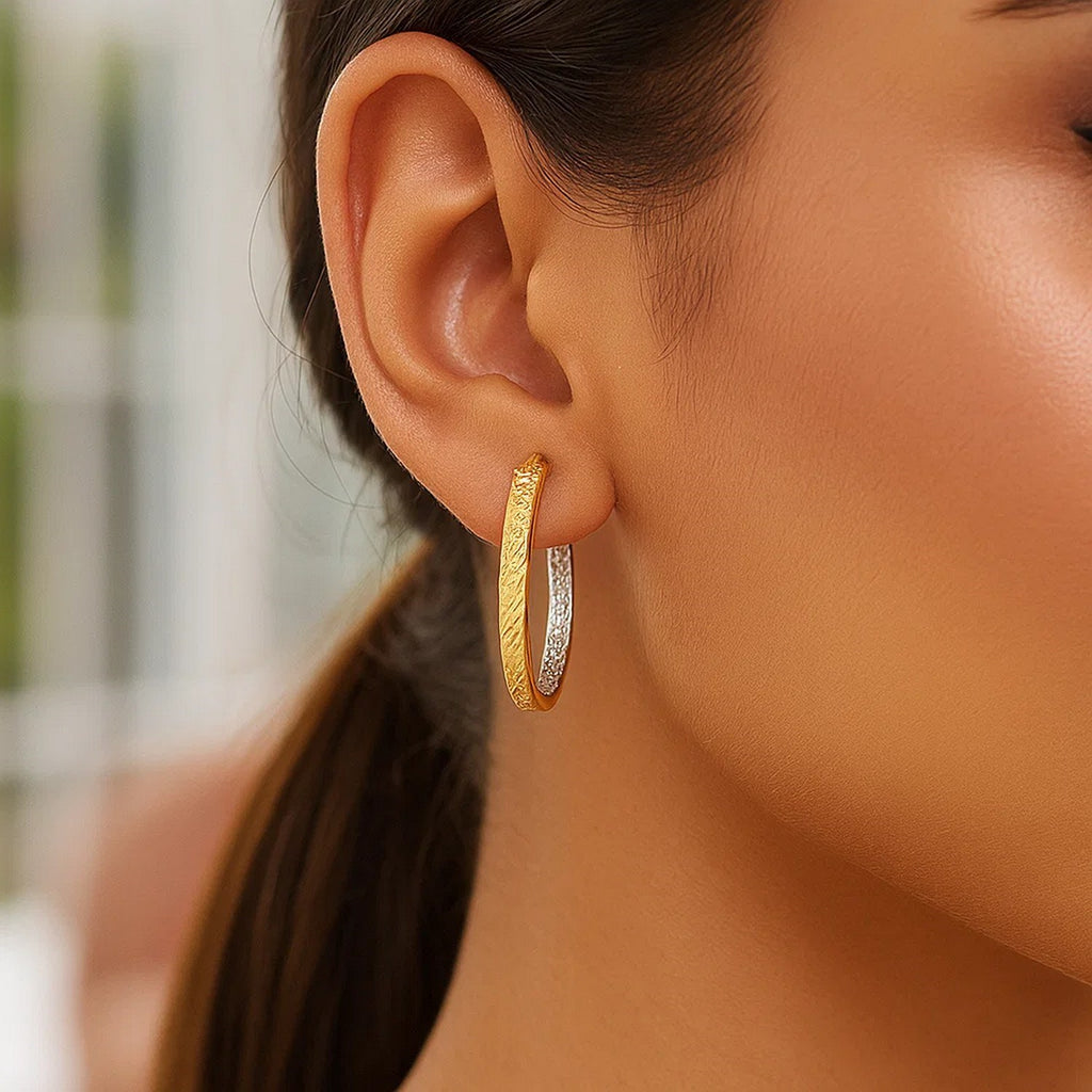 14k two-tone yellow and white gold textured hoop earrings, showcasing modern elegance and luxurious craftsmanship.